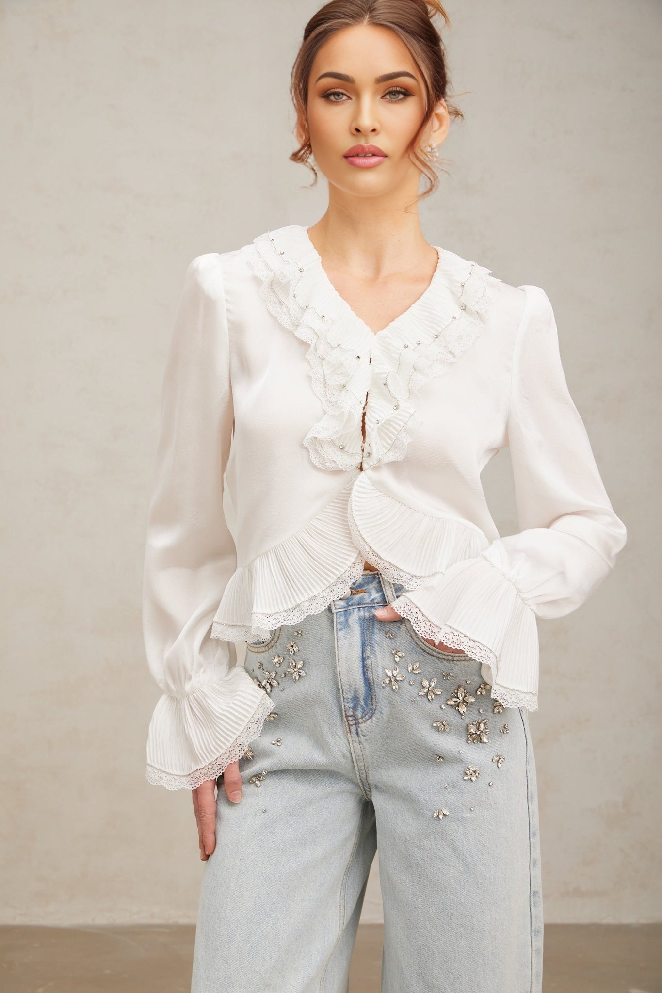 White buttonup shirt with lace trim and ruffled details named Aimee
