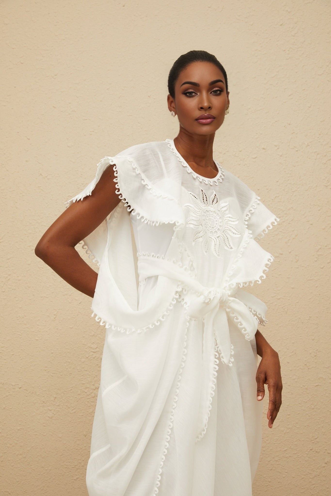 White cotton maxi dress with floral embroidery and cap sleeves