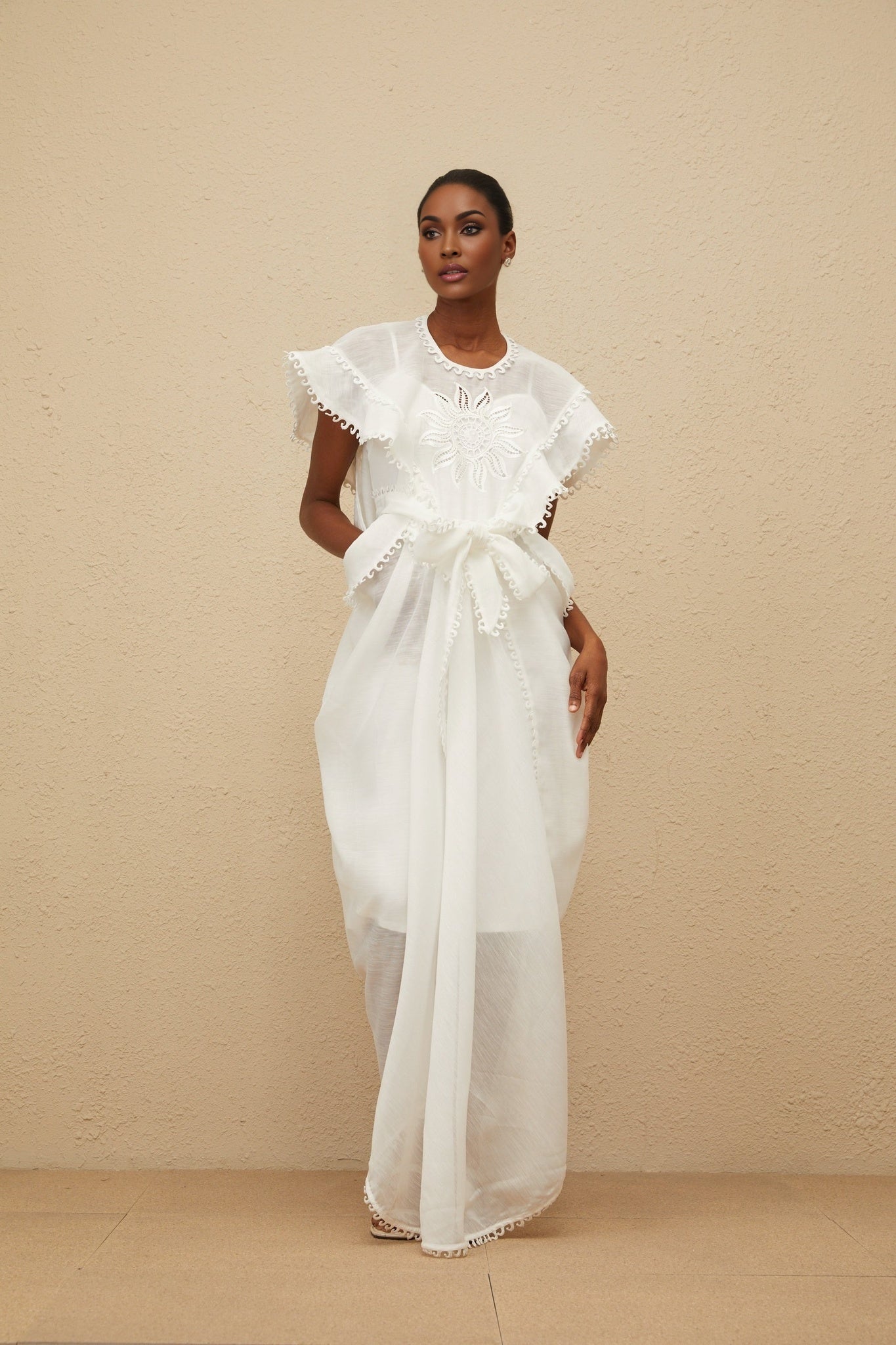 White cotton maxi dress with floral embroidery and cap sleeves