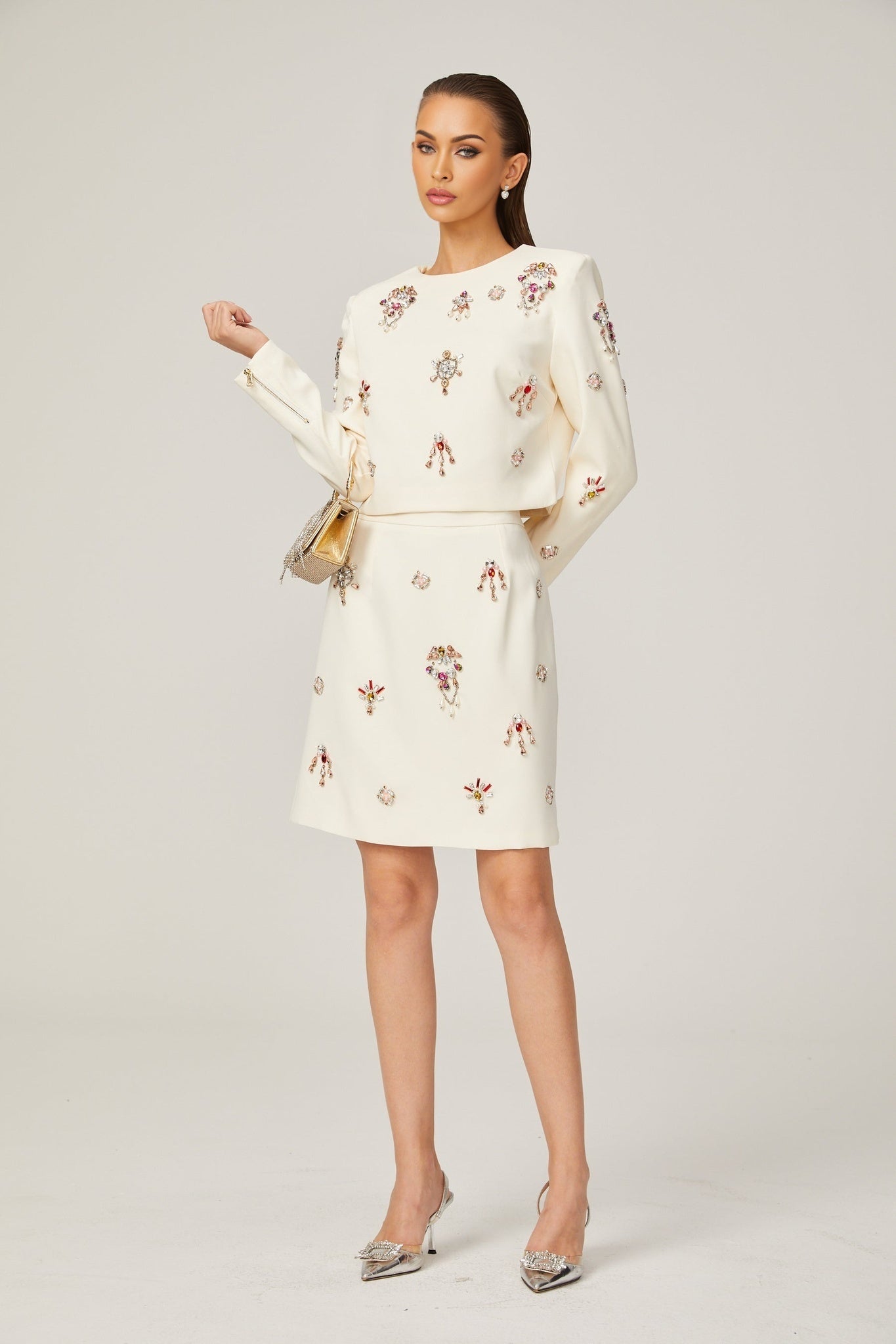 White crystalembellished matching set consisting of a top and skirt named Jeanne