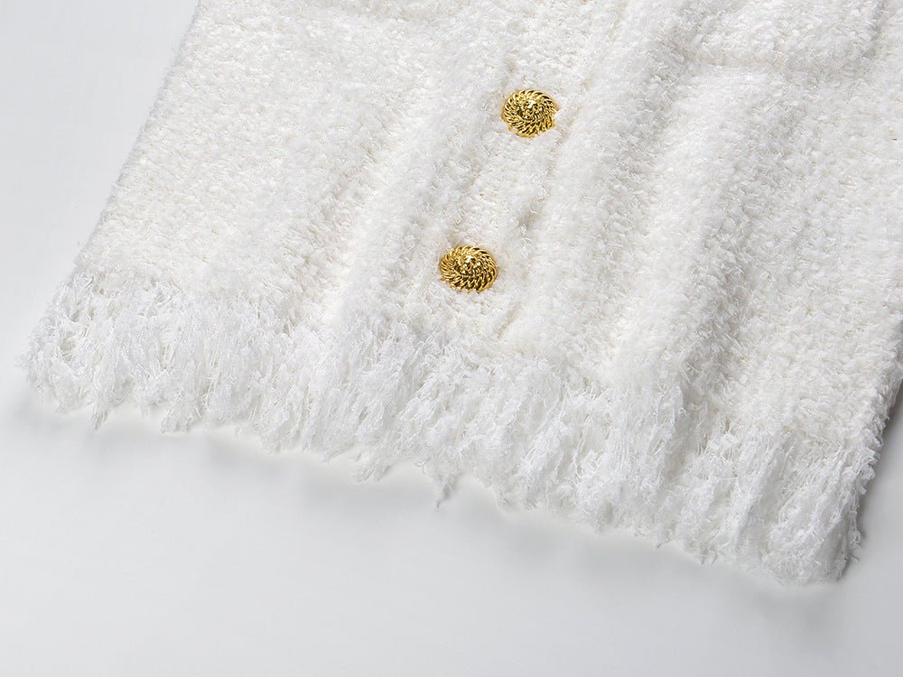 White double-breasted blazer and skirt set with fringed edges and gold button details