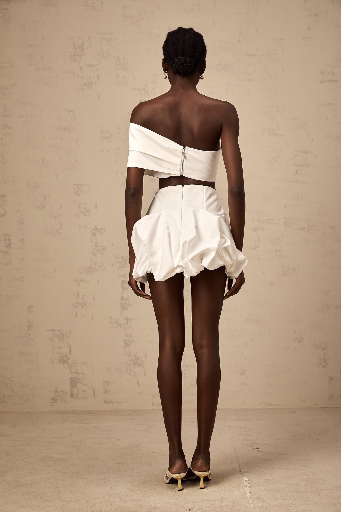 White floral print matching set with pleated top and skirt by Honorine
