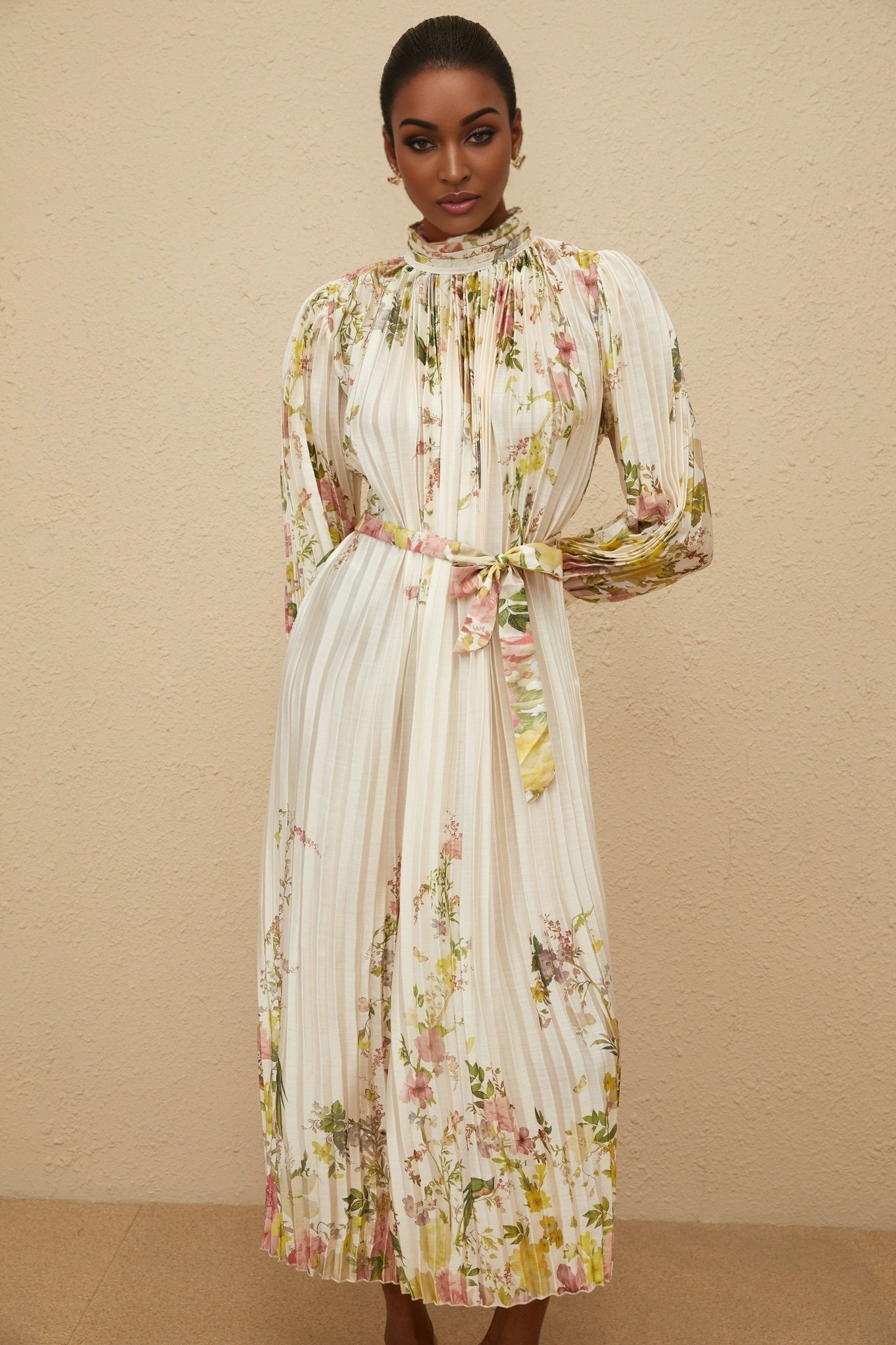 White floral print turtleneck dress with cinched waist and pleated design