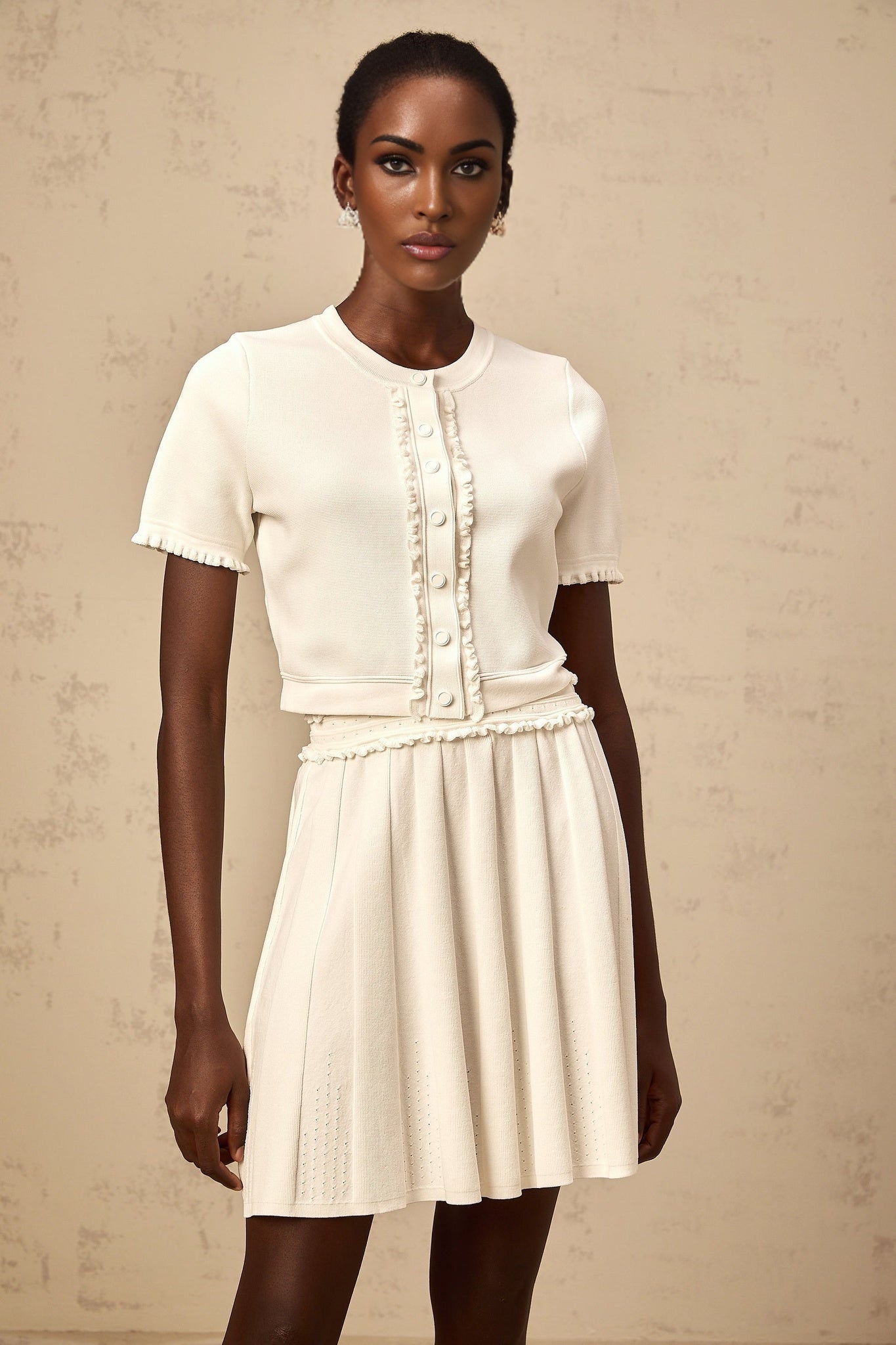 White knit matching set featuring a ruffled trim top and skirt inspired by Zelda style