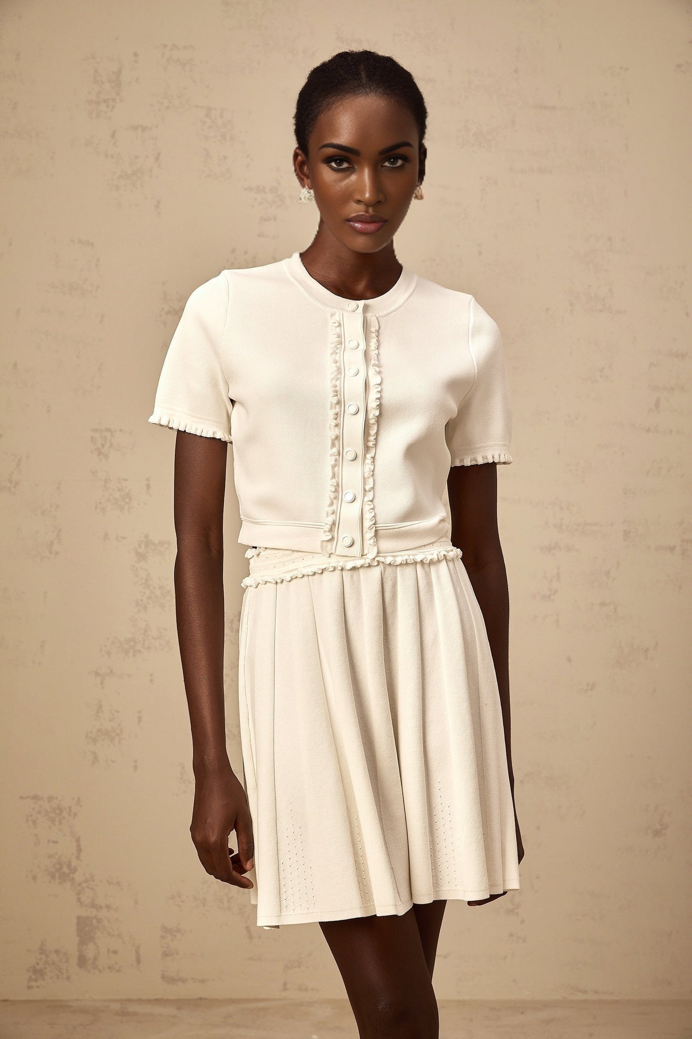 White knit top and skirt set with ruffled trim inspired by Zelda featuring a matching design