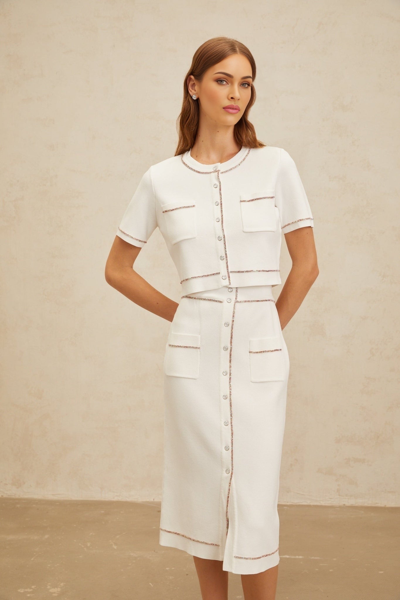 White knitted top and skirt set with crystal embellishment, ribbed hem, and press-stud fastening