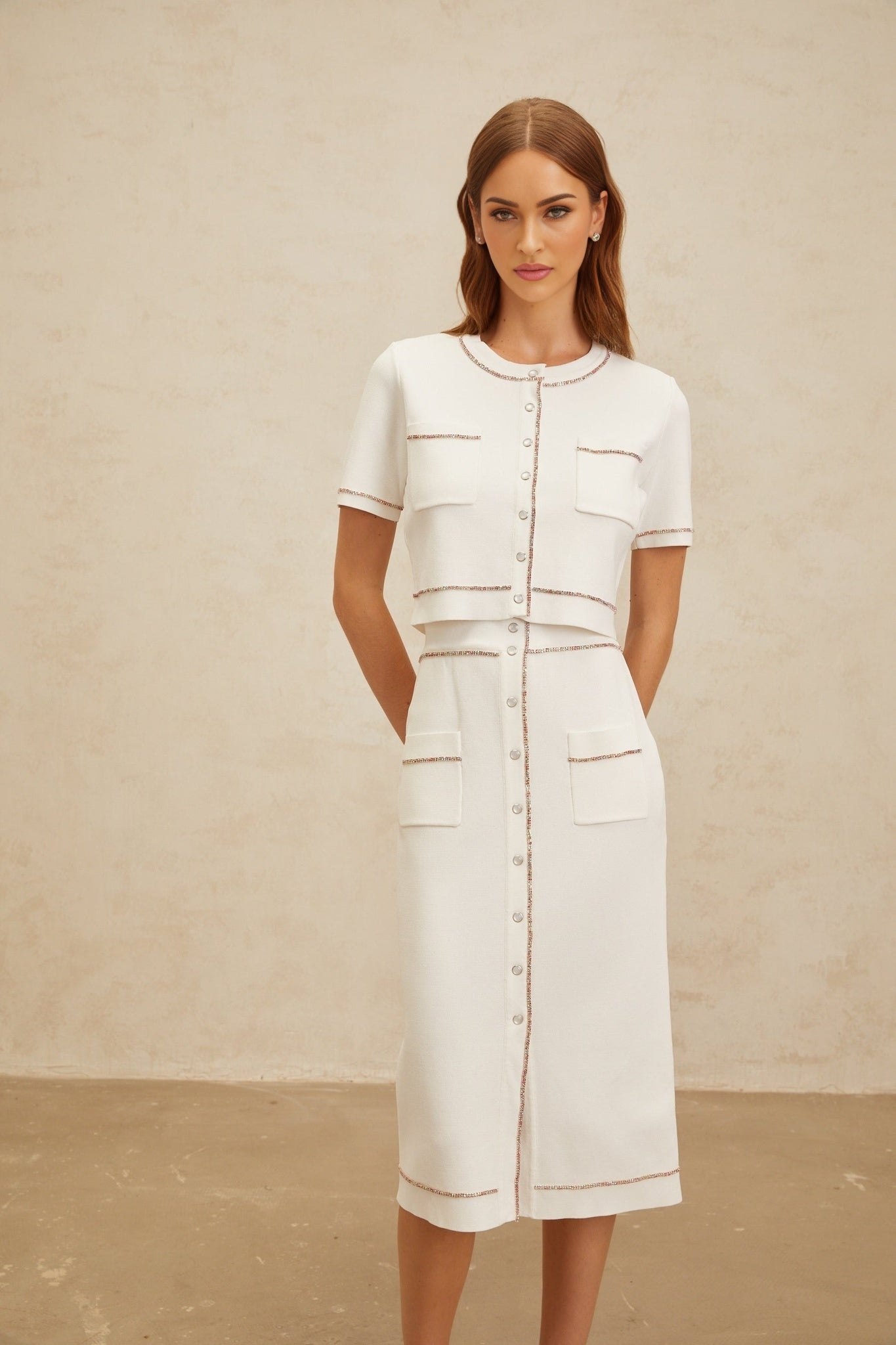 White knitted top and skirt set with crystal embellishment, ribbed hem, and front press-stud fastening
