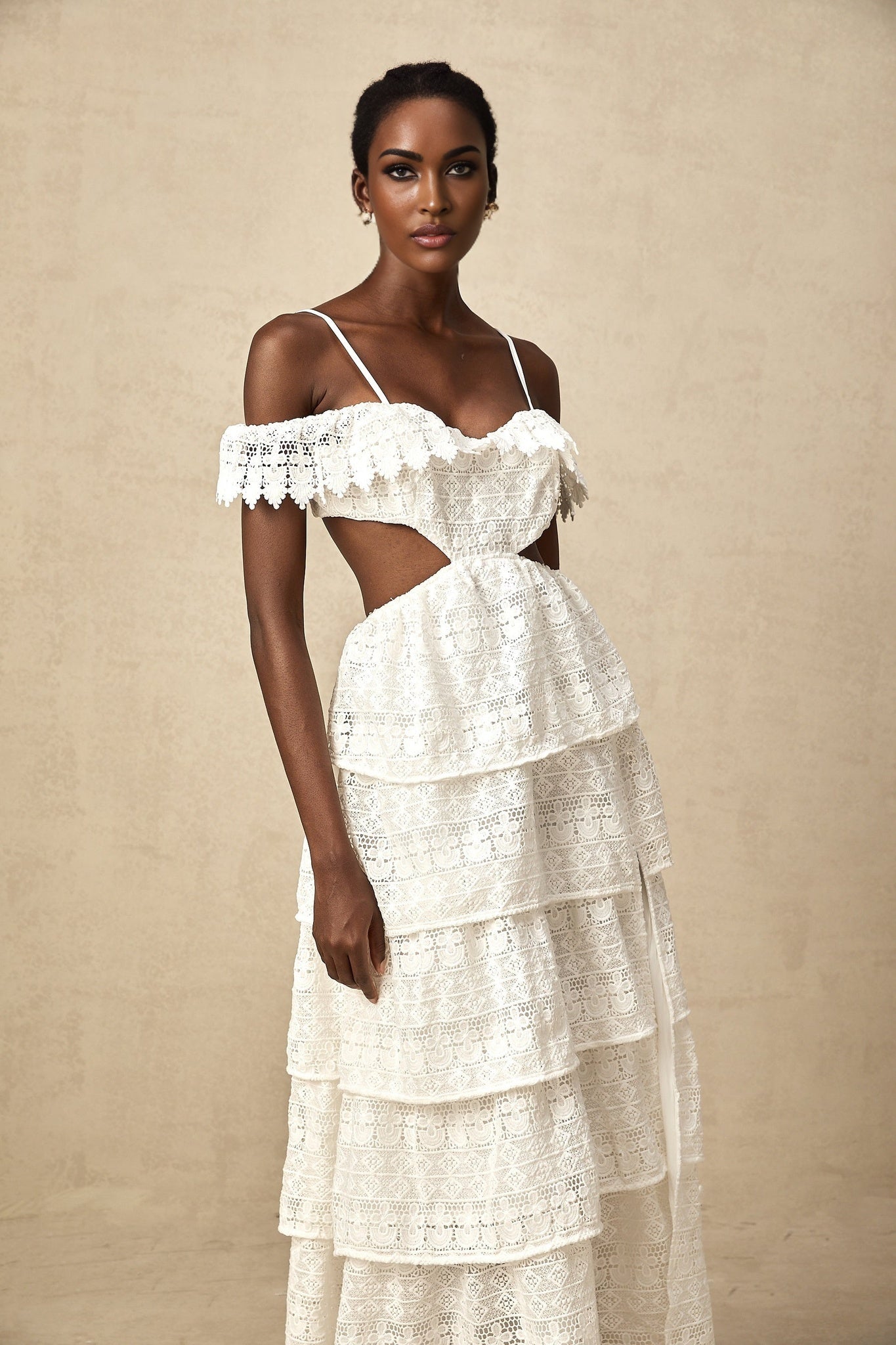 White lace midi dress with open work design named Genevieve featuring a delicate pattern and feminine silhouette