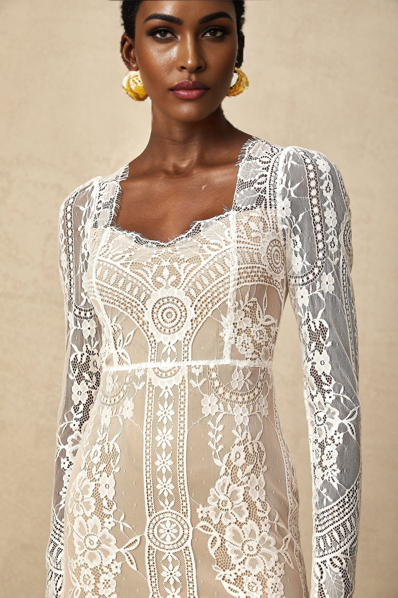 White lace mini dress with scalloped hem and delicate floral pattern