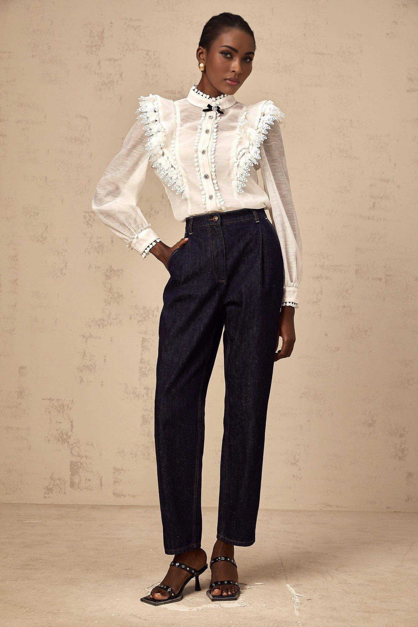 White lace trimmed semi sheer shirt called Capucine on a plain background