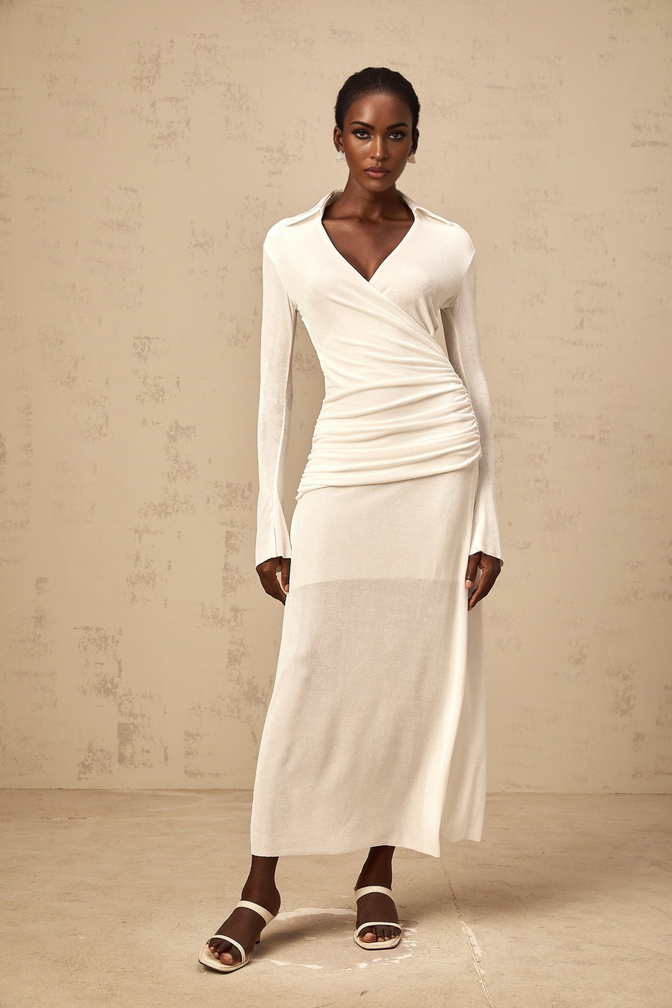 White long knitted dress with ruched detailing and maxi length featuring Terebenthine design
