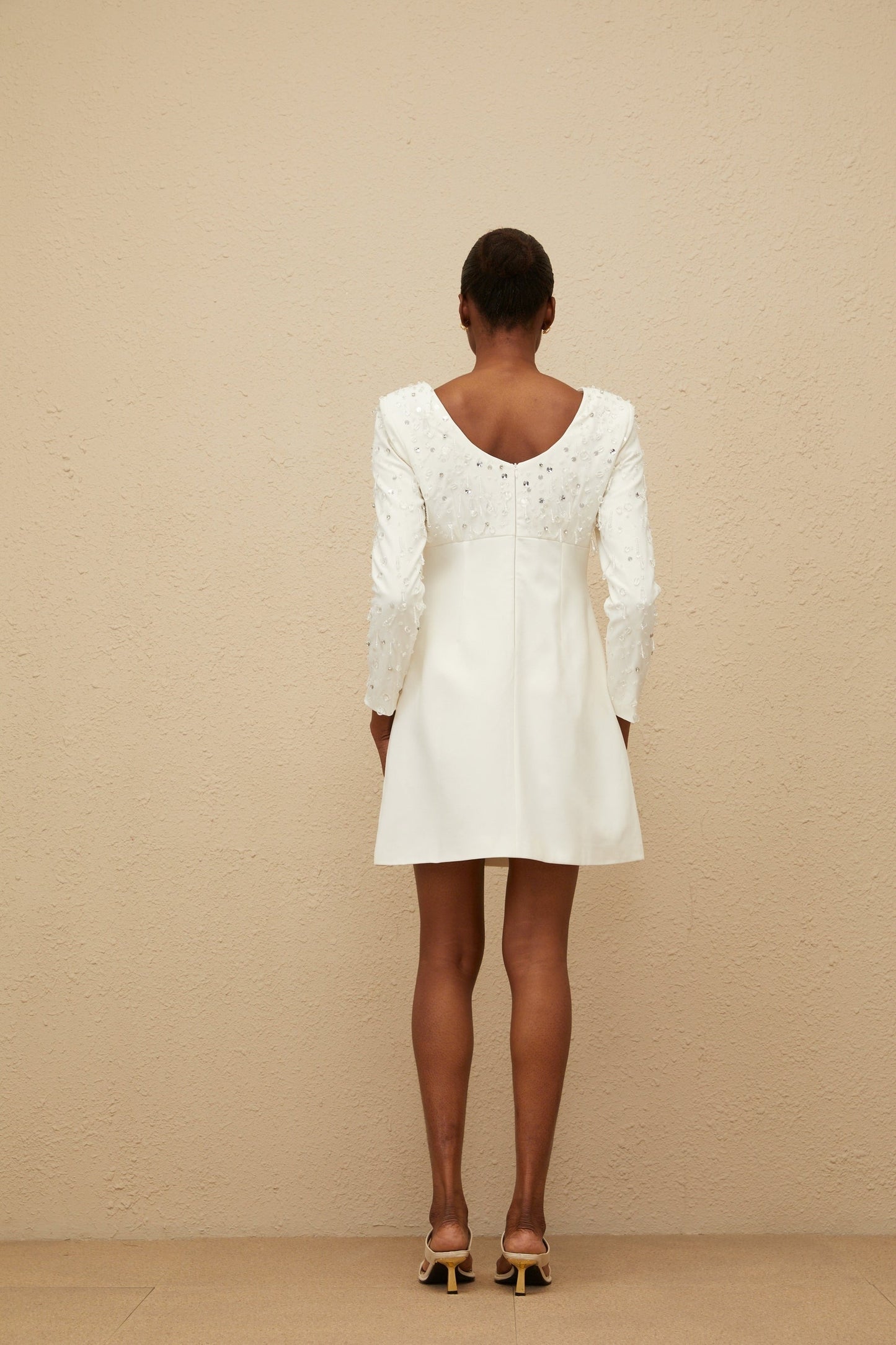 White long sleeve A-line dress with sequin and crystal embellishments