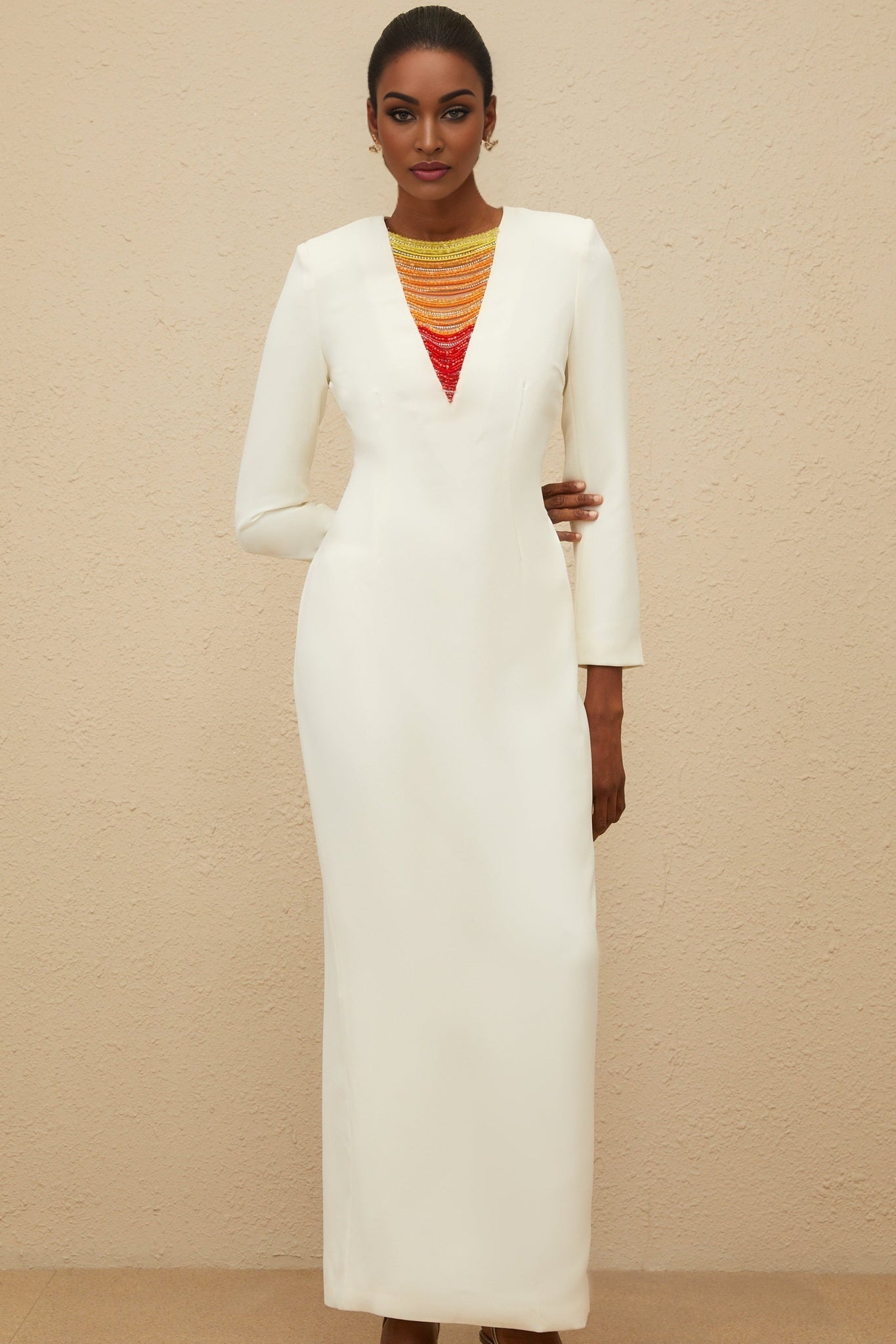 White long sleeve maxi dress with bead and rhinestone embellishments