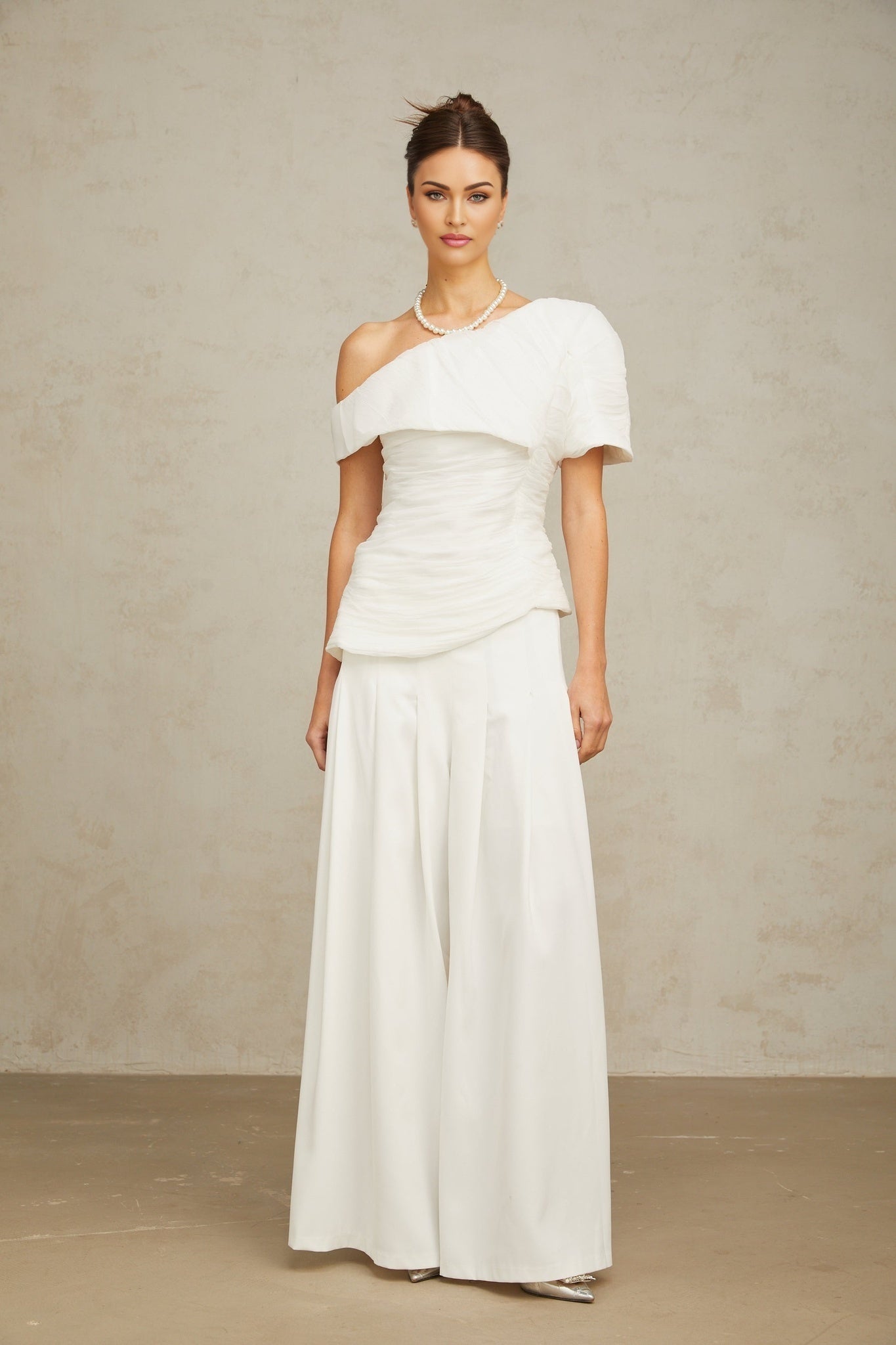 White matching set featuring a creased top and trousers named Adele
