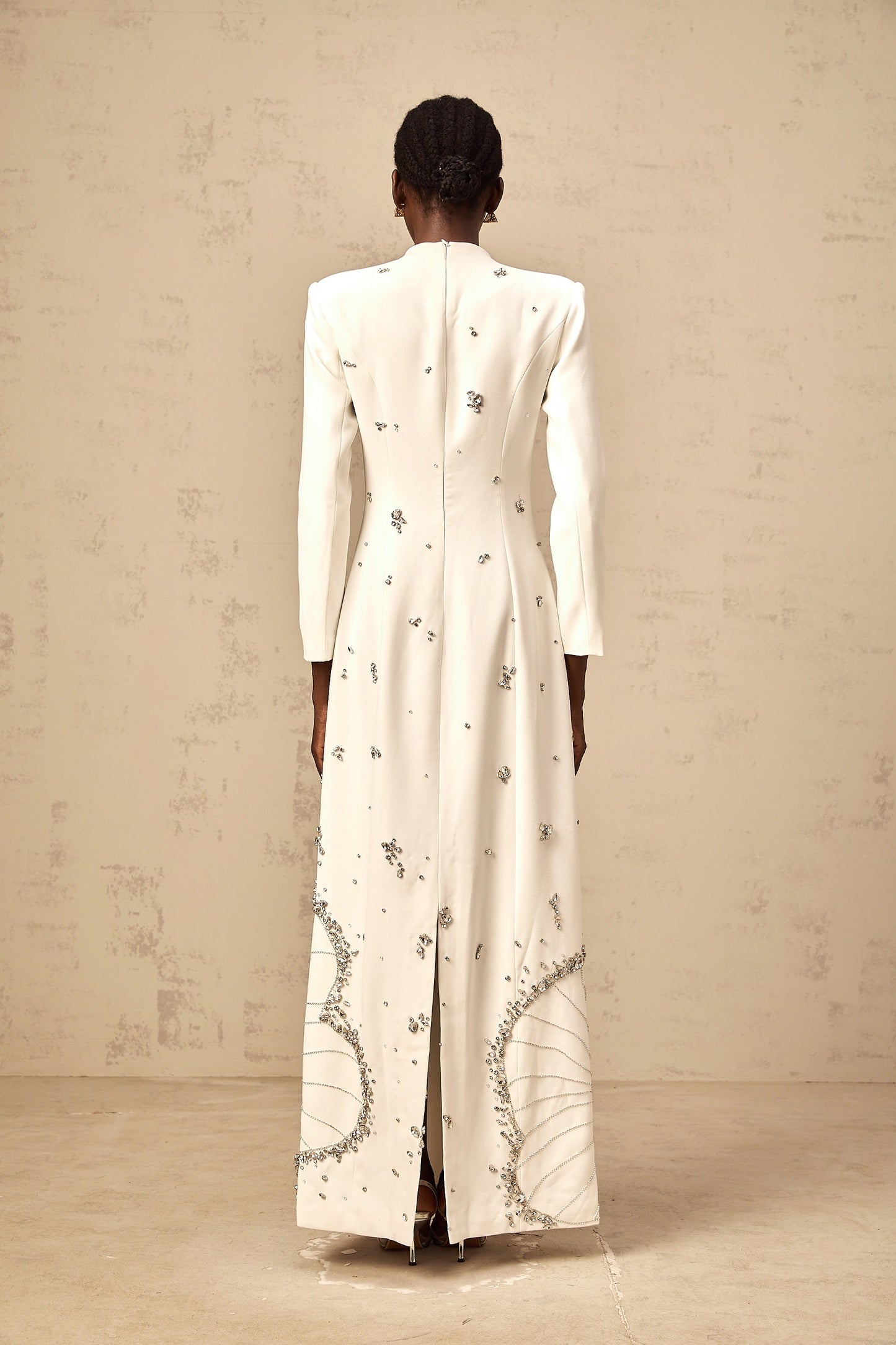 White maxi dress with lotus flower embellishments named Daphne