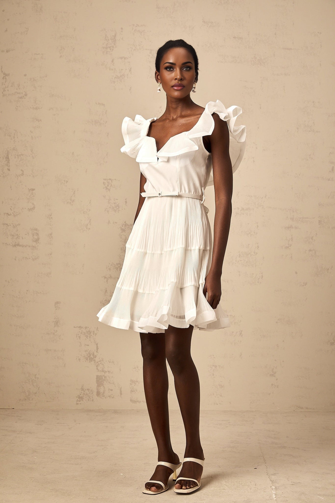 White mini dress with frilled neckline and pleated design named Eliane