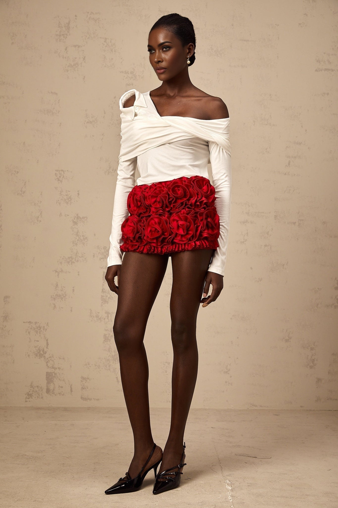 White sleeveless jersey top with asymmetric design and twisted fabric detail