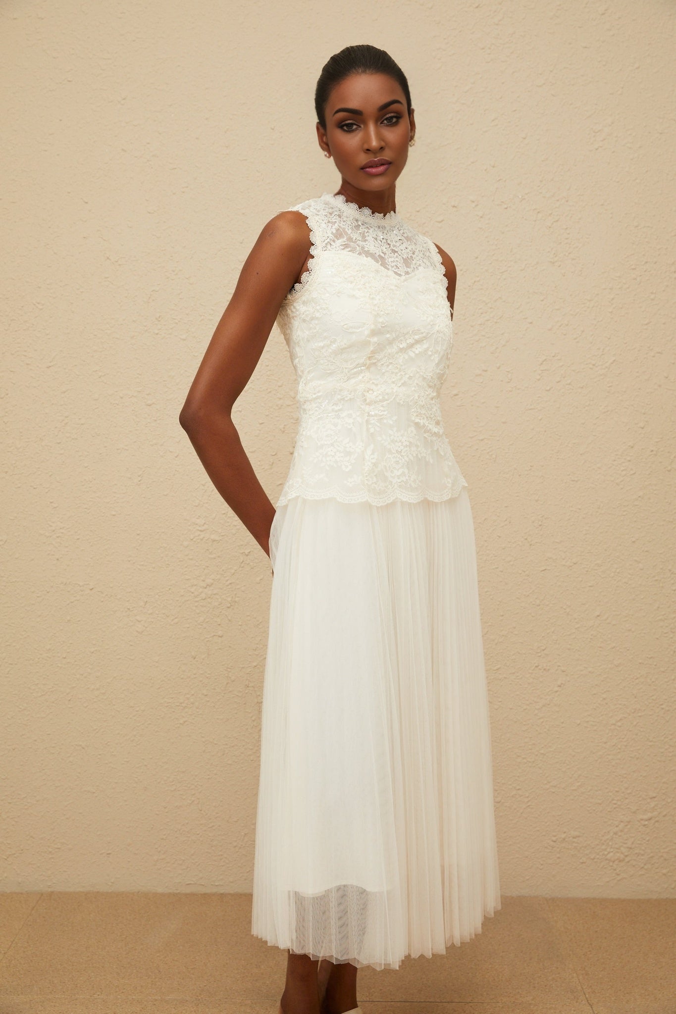 White sleeveless peplum waist midi dress with floral lace and sequin detailing