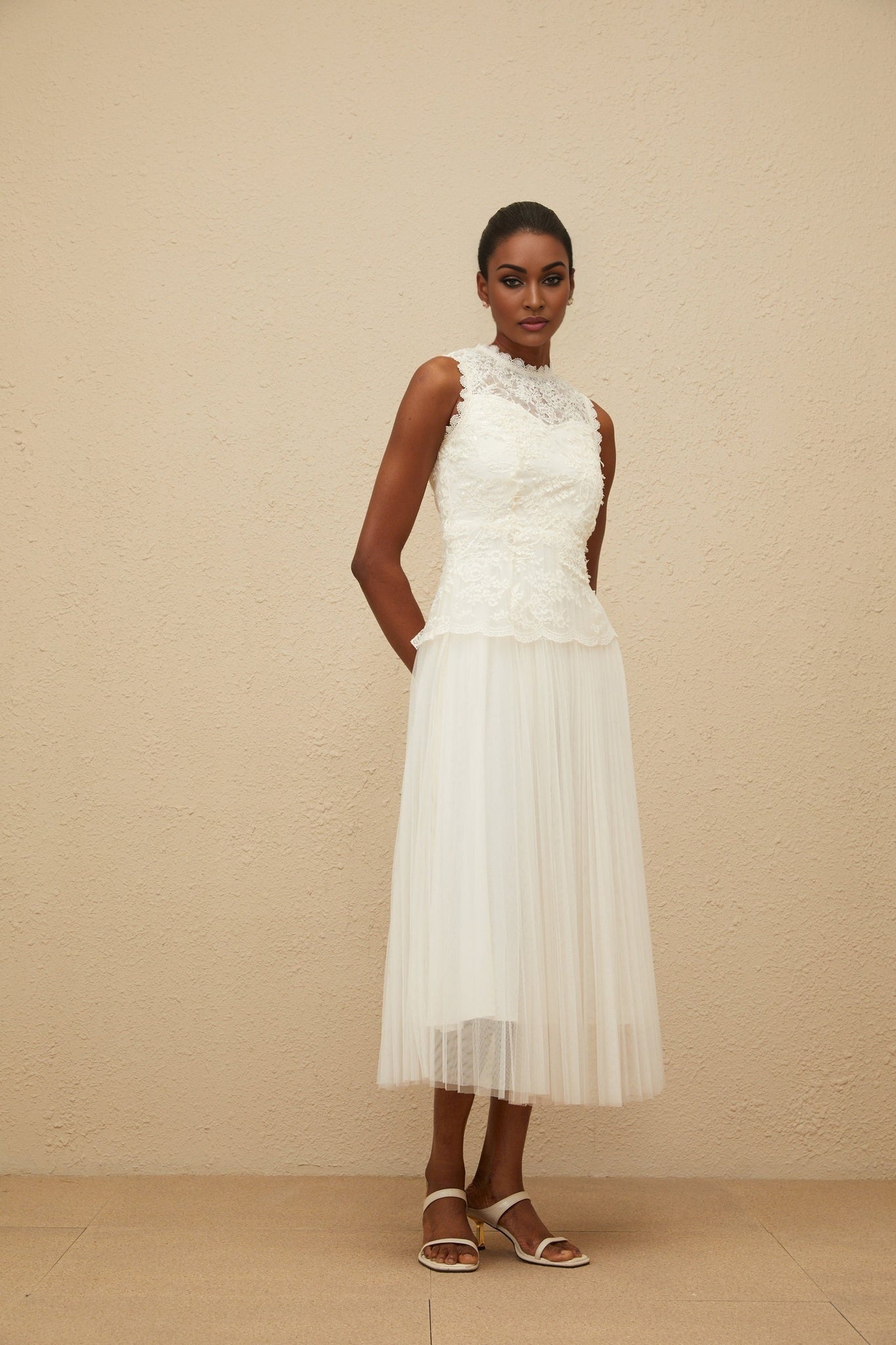 White sleeveless peplum waist midi dress with floral lace and sequin detailing