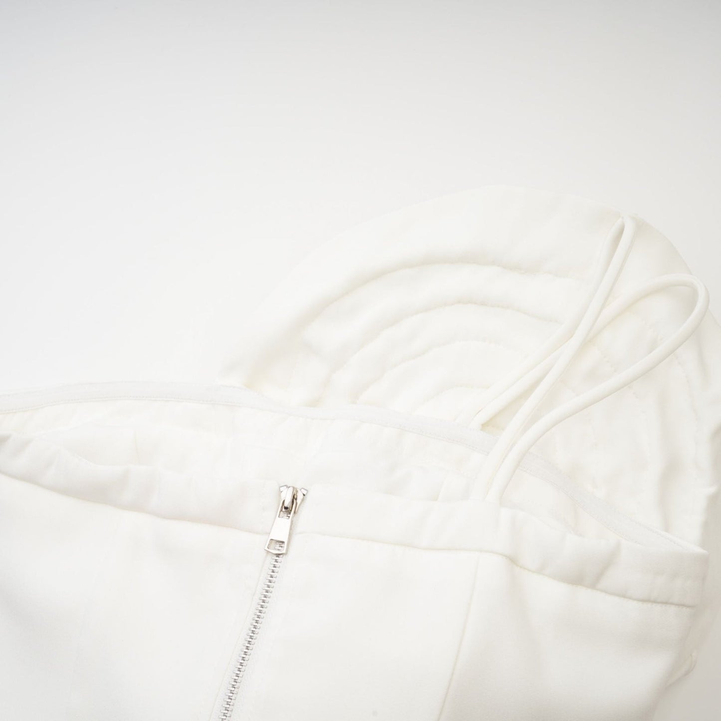 White sleeveless top with floral applique details named Lucie