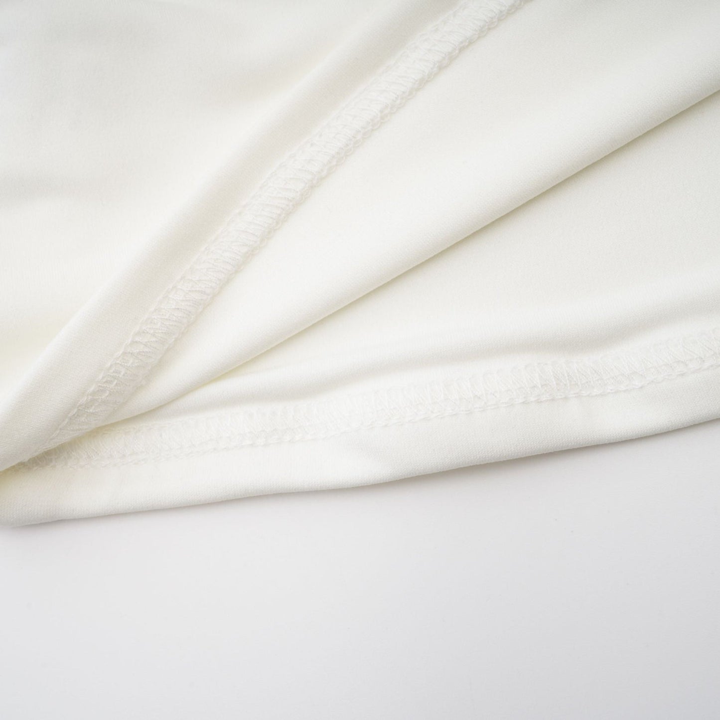 White sleeveless top with gathered detail and ruching named Rosalie