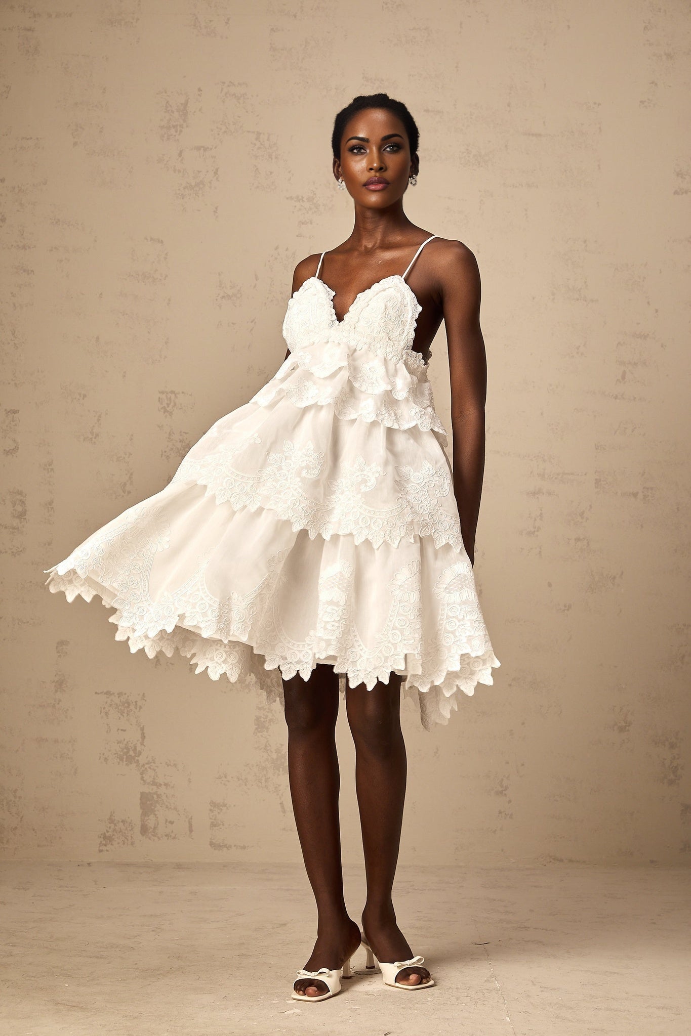 White tiered mini dress with guipure lace detailing named Valeria