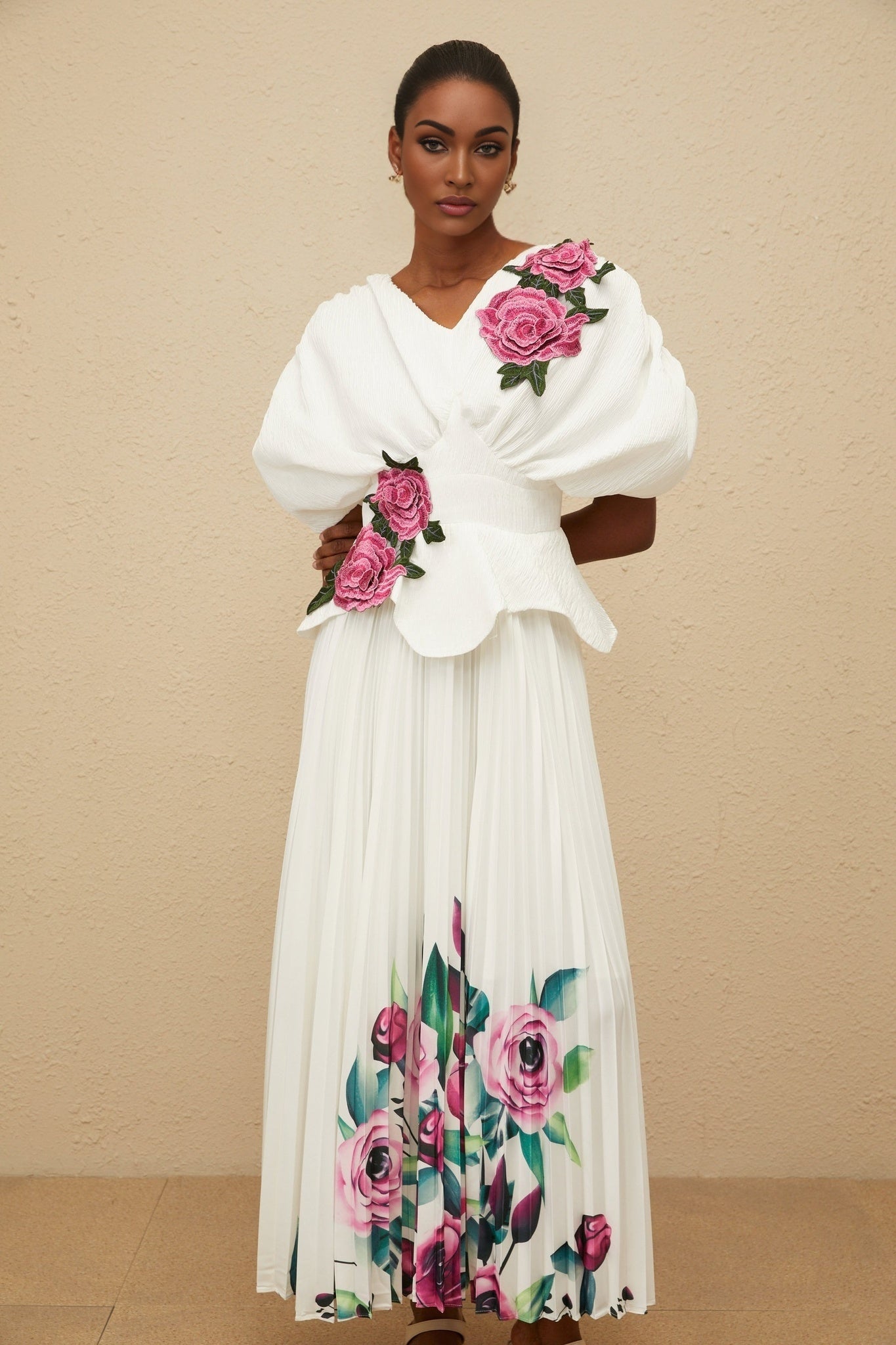 White V-neck Batwing Sleeve Floral Embroidered Shirred Effect Rear Zip Fastening Curved Hem Top and High Rise Pleated Rose Print Maxi Length Skirt in 100% Terylene Fiber