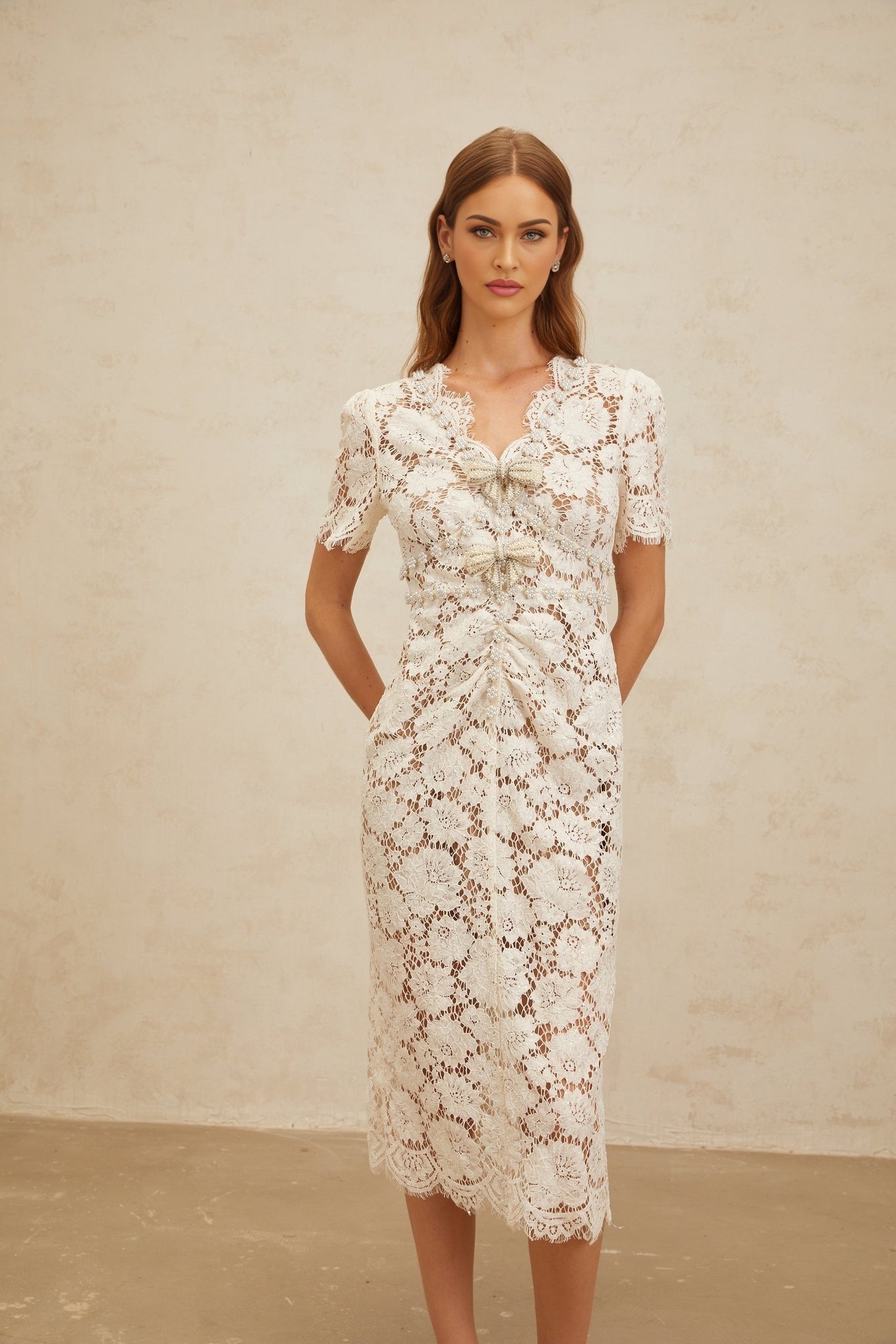 White V-neck short sleeve midi dress with glitter detailing and bow brooch