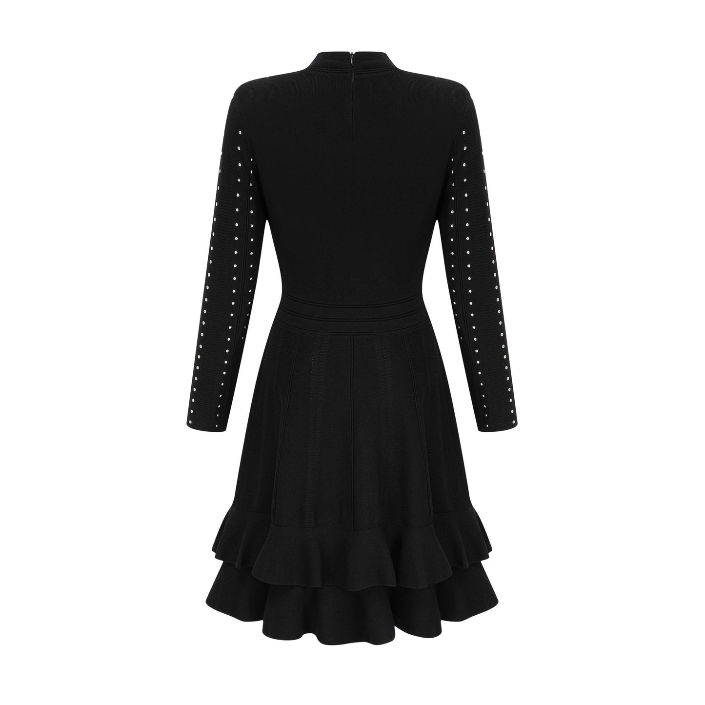 Woman wearing a black knitted mini dress with embellishments and ruffles