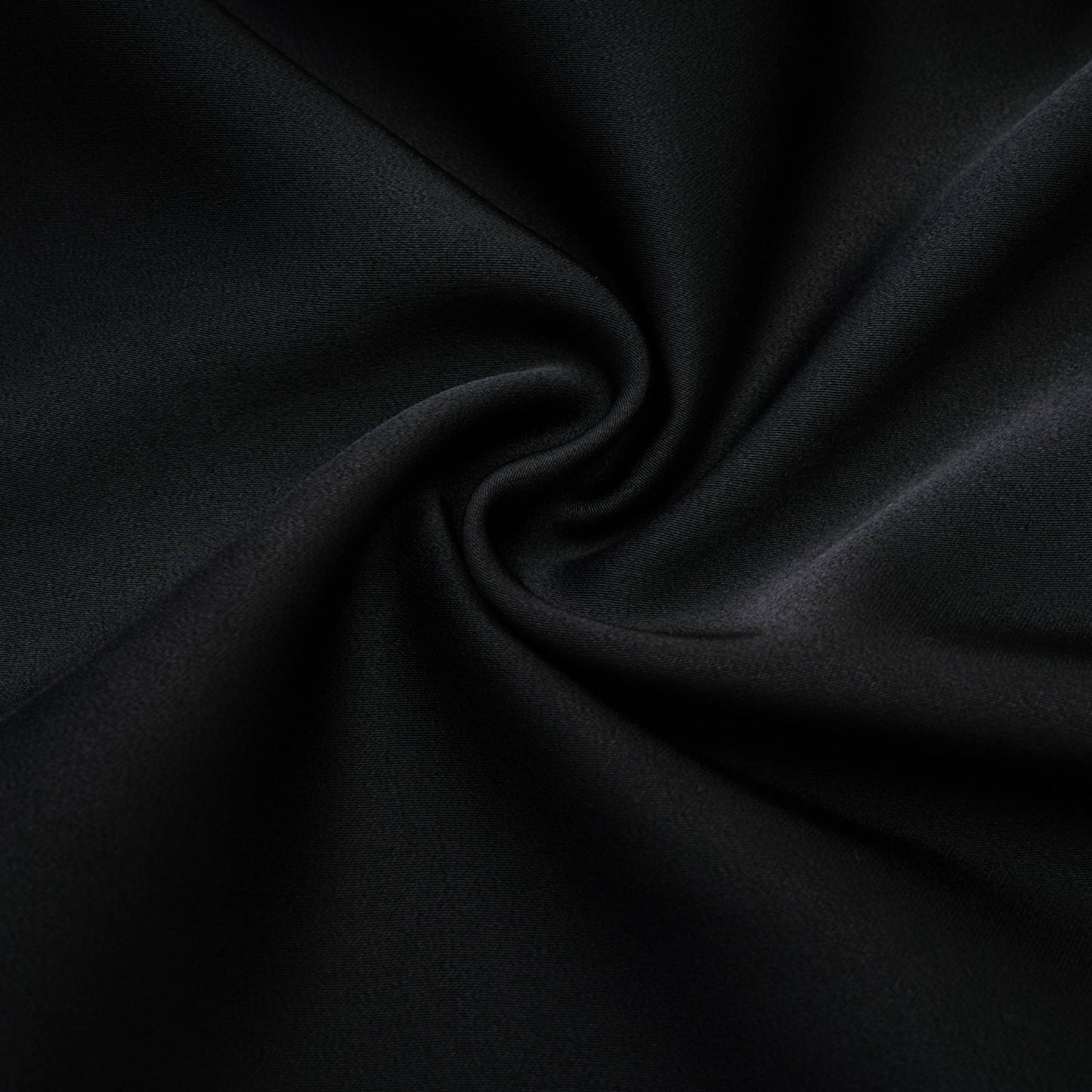 Anklelength black dress with spaghetti straps flower decoration at neck open back and 100% Polyester composition