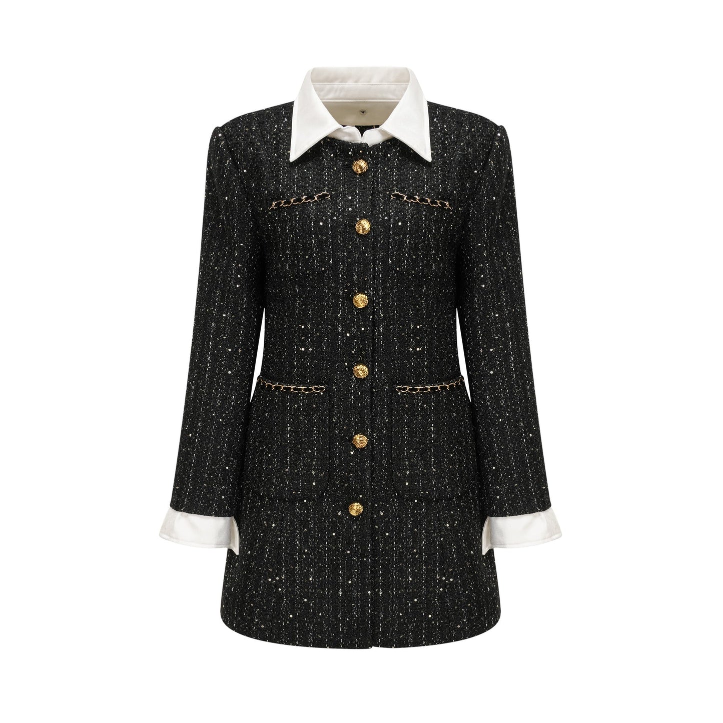 Woman wearing a black mini dress with sequin panels and tweed fabric featuring a sleeveless design and round neckline