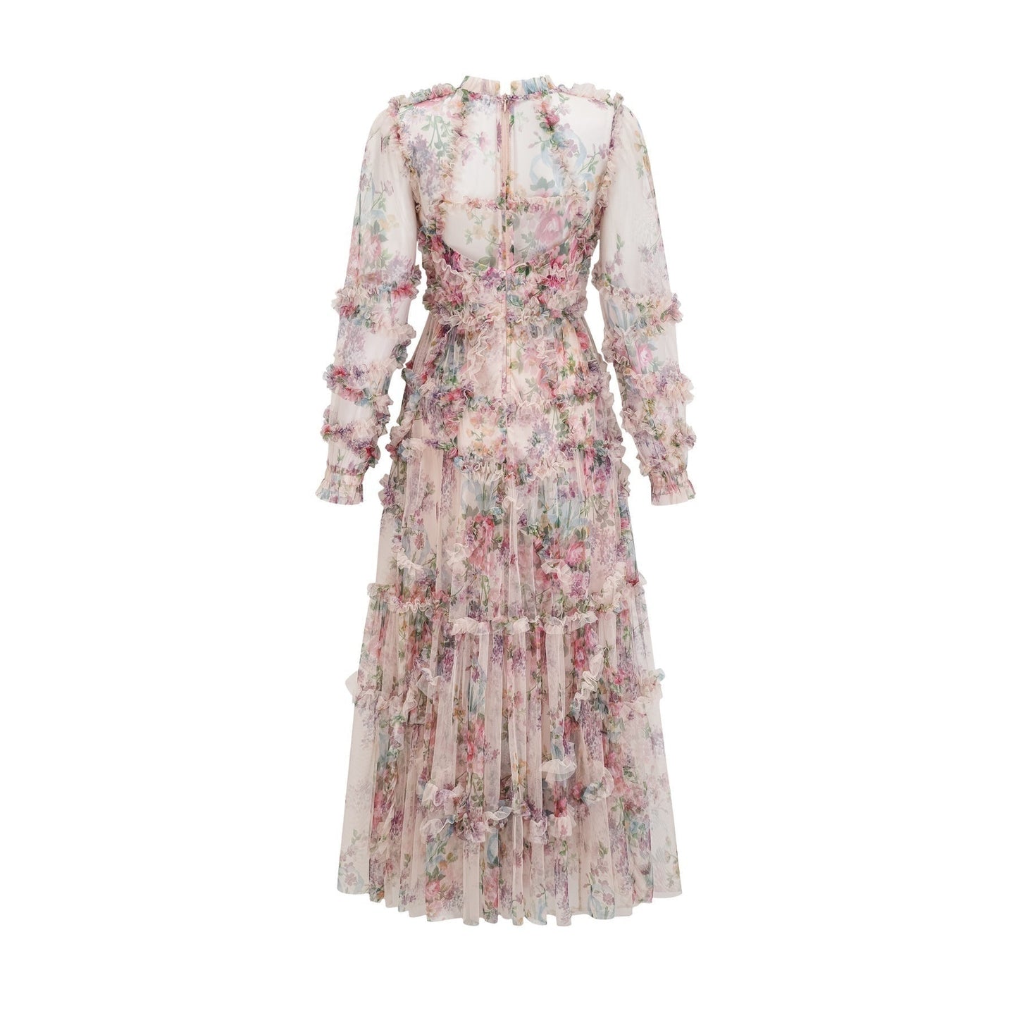 Woman wearing a lightcolored floral midi dress with ruffled details and tulle fabric standing in a neutral background