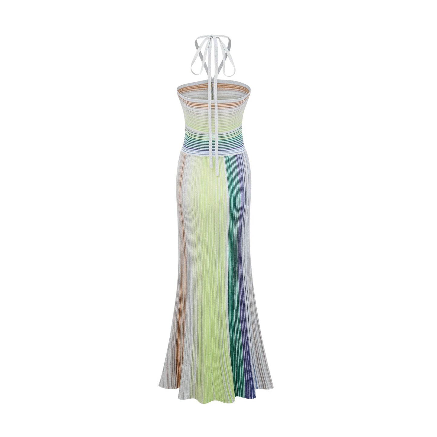 Woman wearing a long metallic knit maxi dress with backless design standing in elegant pose