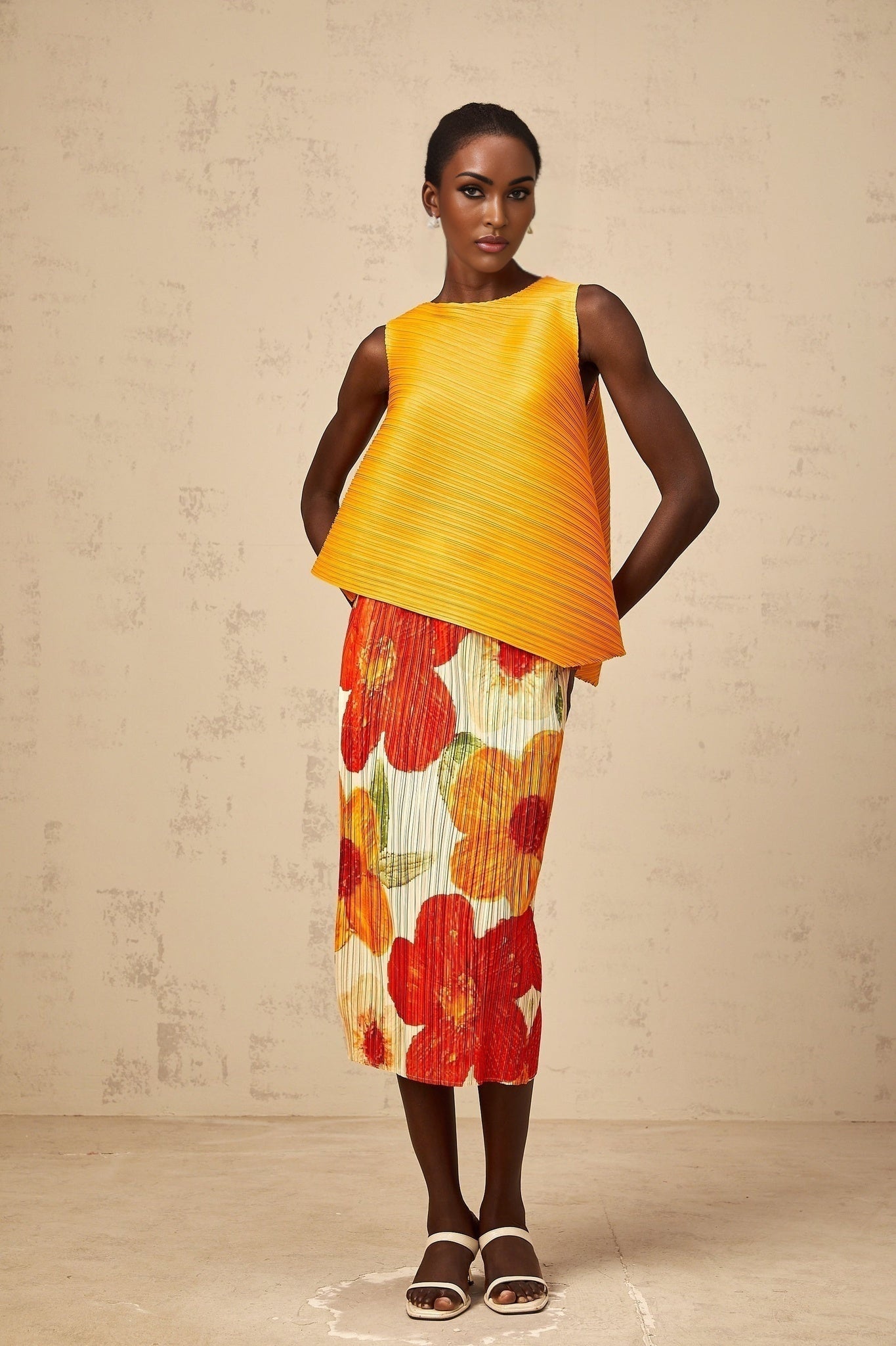 Woman wearing a matching set consisting of a top and skirt in amberorange color with a crinkled texture