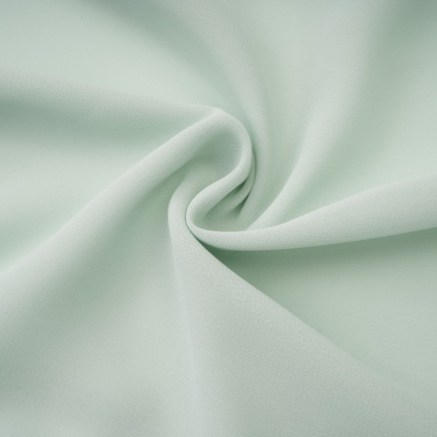 Woman wearing a midi length dress with embellishments and ruffles