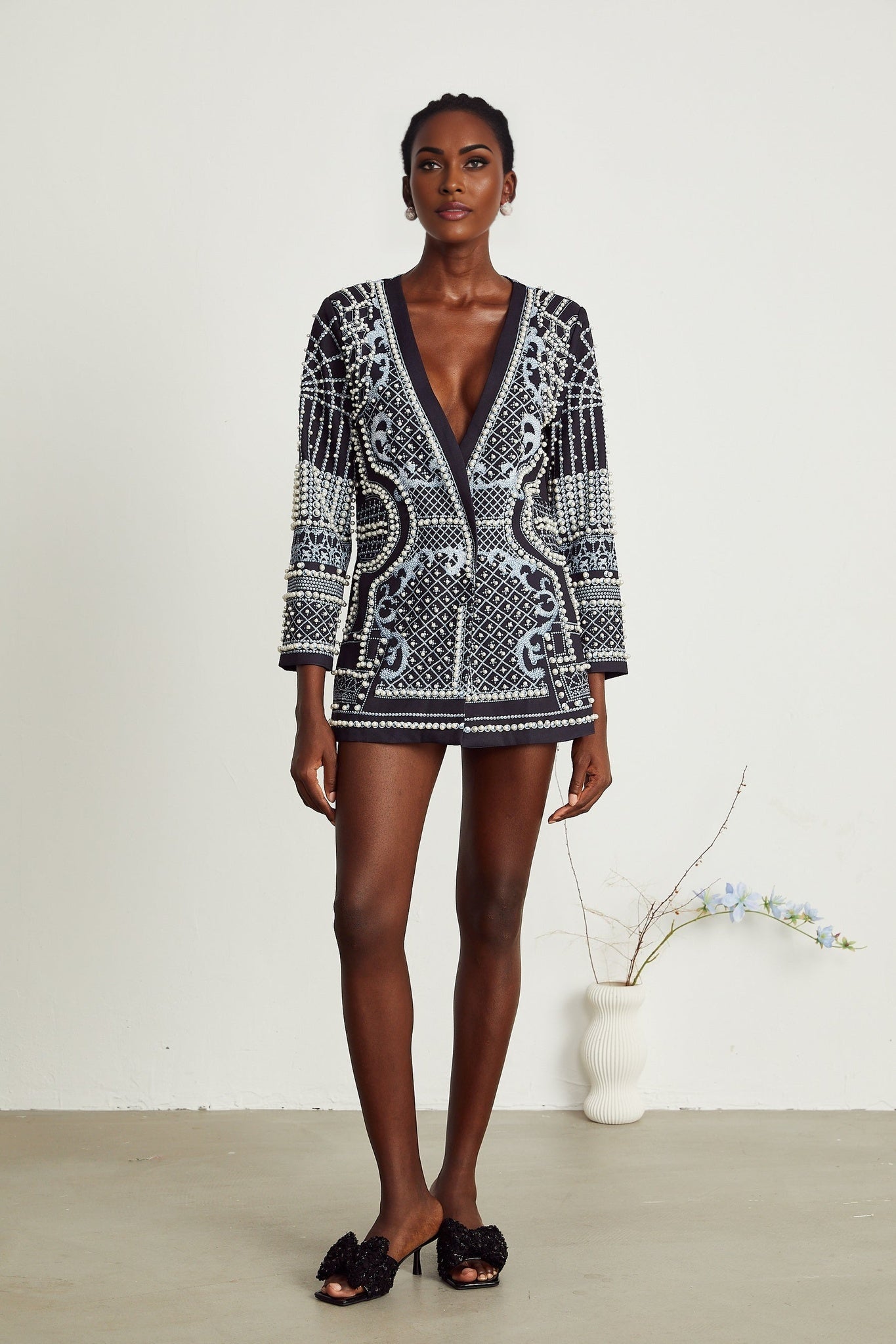 Woman wearing a patternprint blazer dress with Vneck in Catherine style