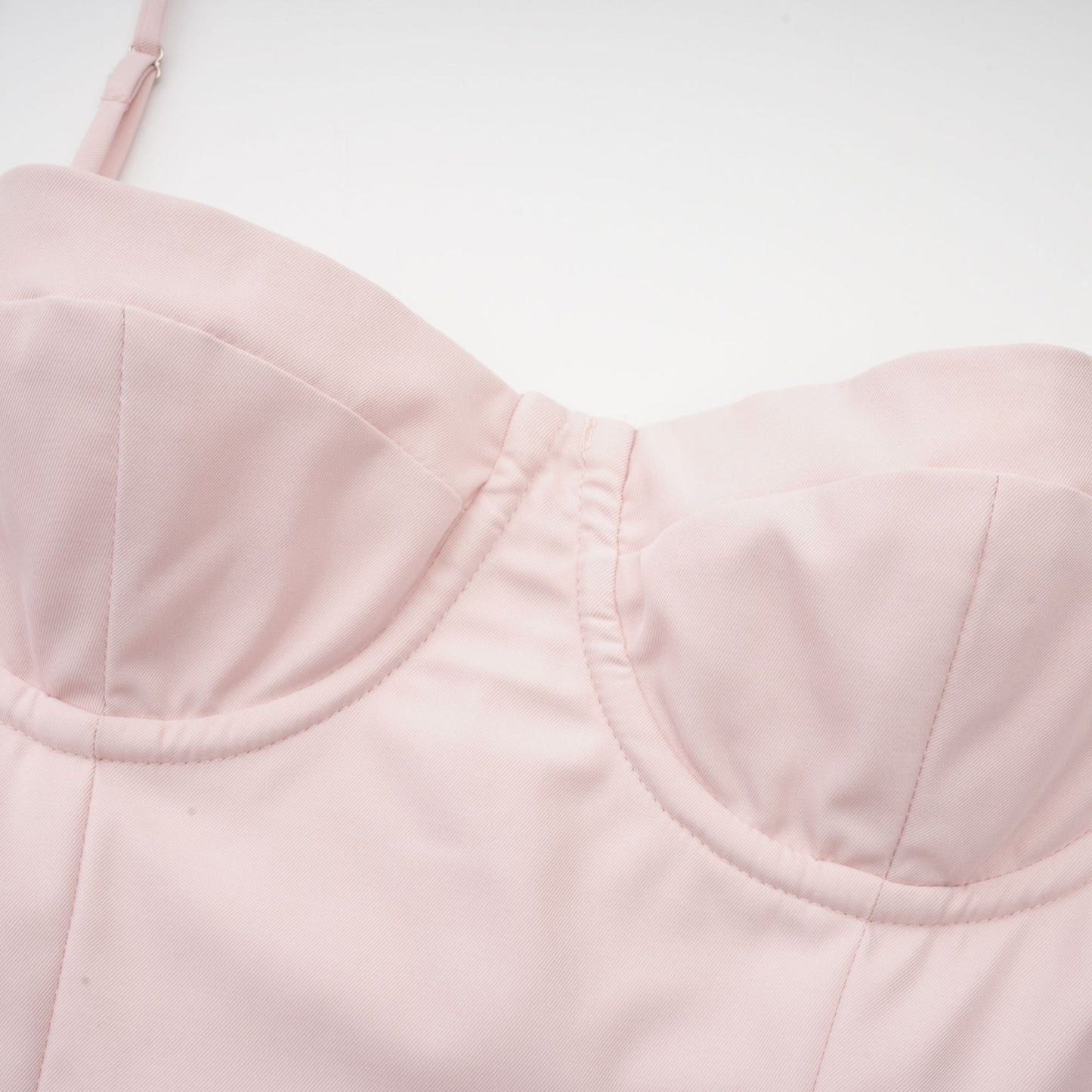 Pink midi dress with sleeveless bustier style delicate spaghetti straps pleated design and flared skirt Features two side inset pockets and rear zip fastening Made of 73% Polyester and 27% Viscose