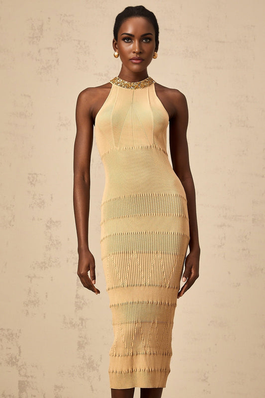 Woman wearing a shimmering kneelength dress with long sleeves and ribbed texture