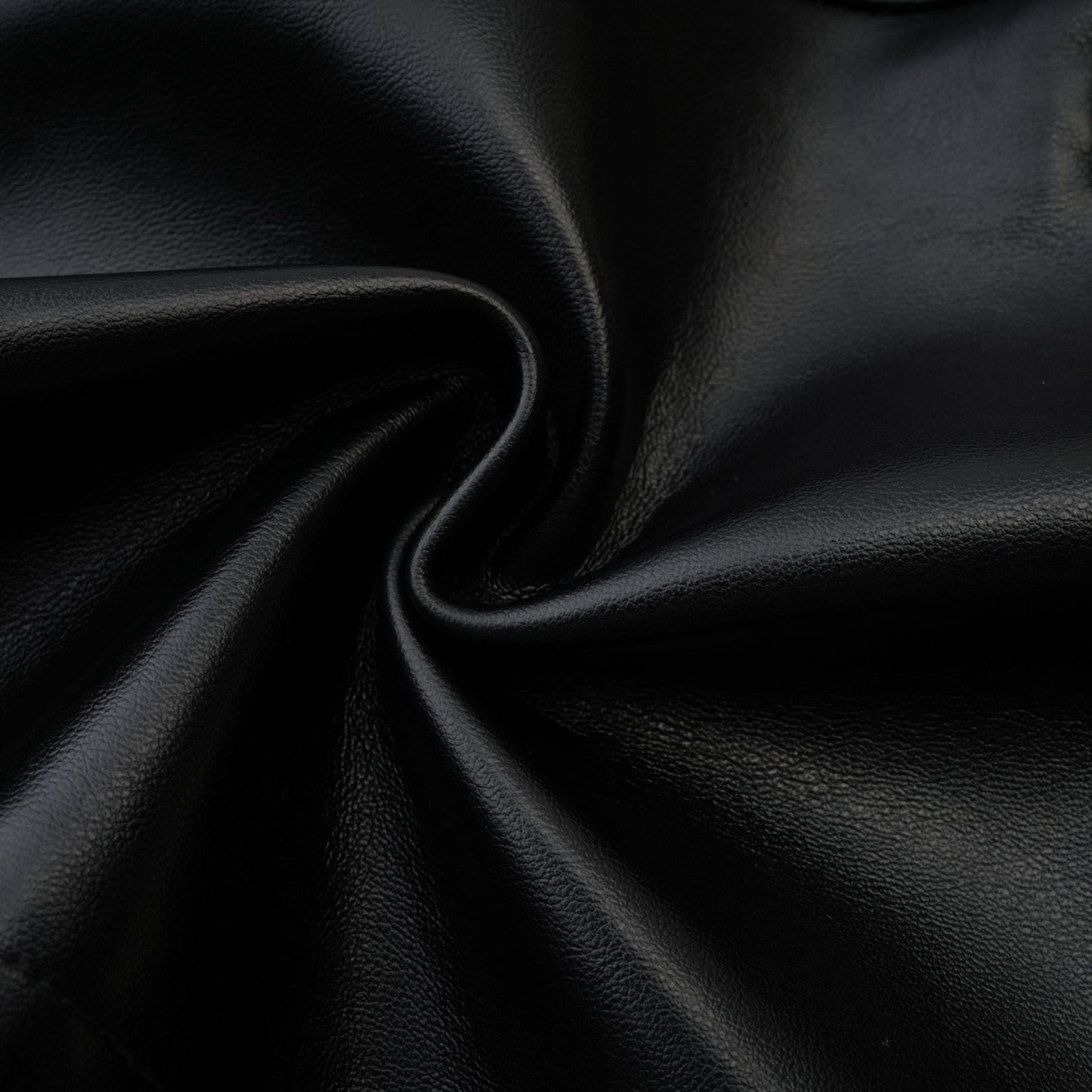 Black bustier style dress with engaging mesh detailing fauxleather finish and stylish asymmetric design