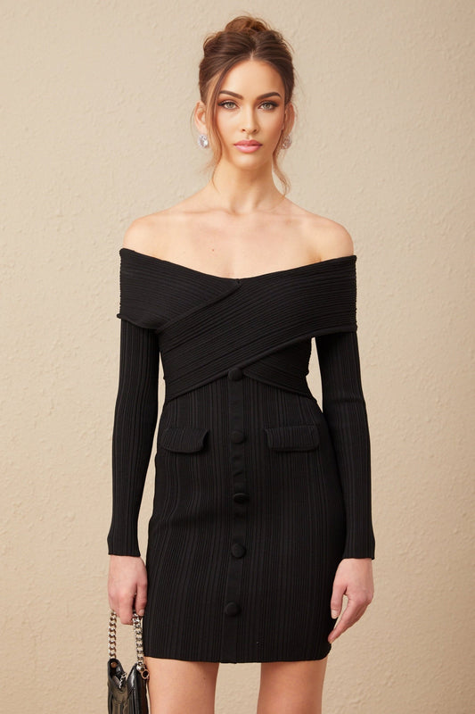 Woman wearing a short offshoulder dress with ribbed texture in light color against plain background