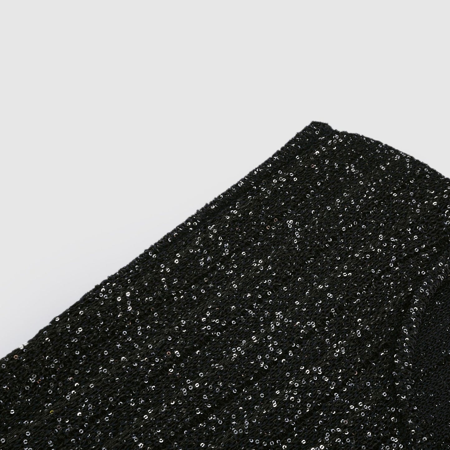 Black sleeveless dress with round neck tiered skirt sequin detailing and knitted design Mini length and composed of 50% Viscose 32% Polyamide 15% Terylene 3% Elastane