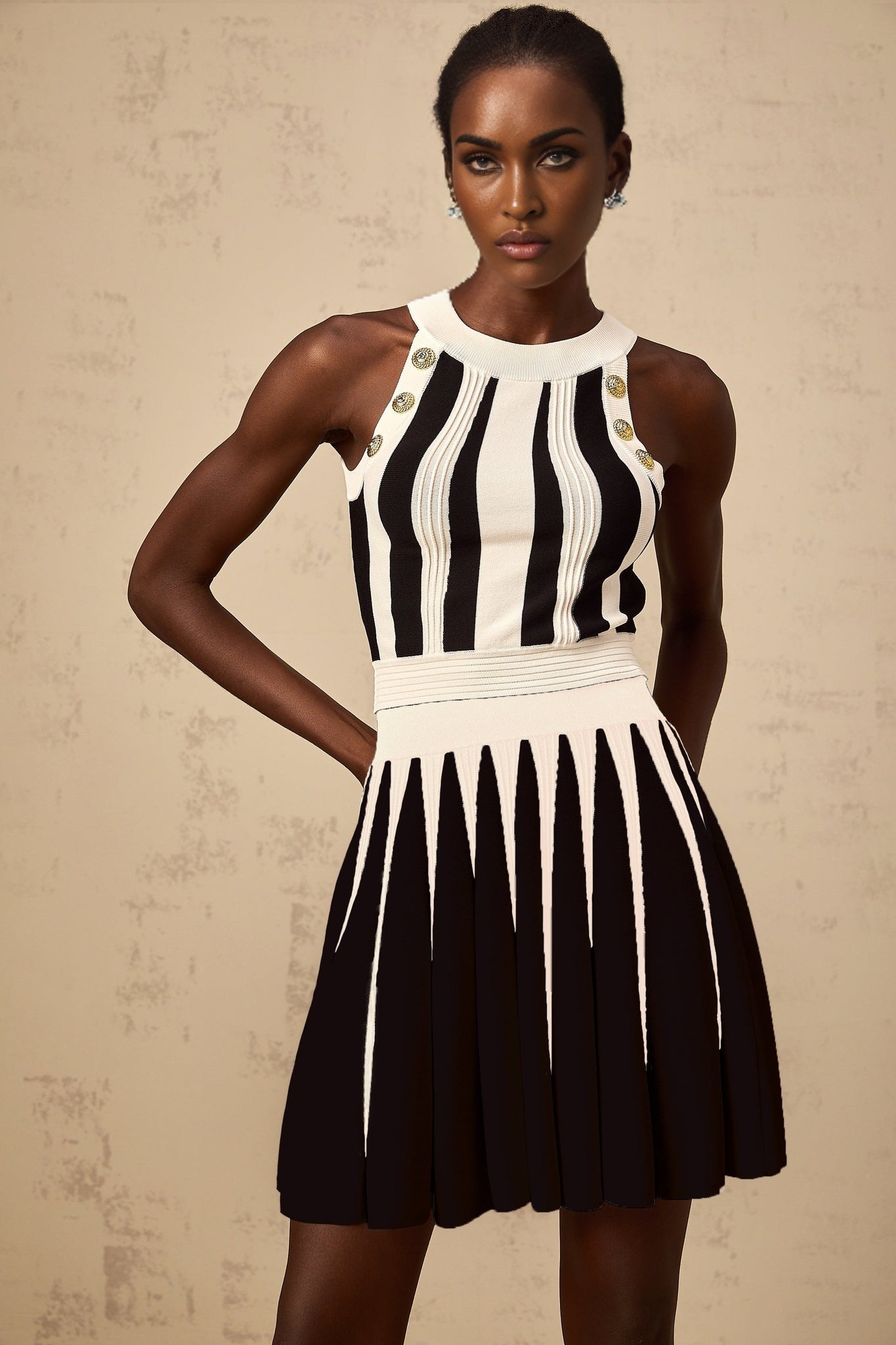 Woman wearing a striped knit top and matching skirt set in contrasting colors named Iseult