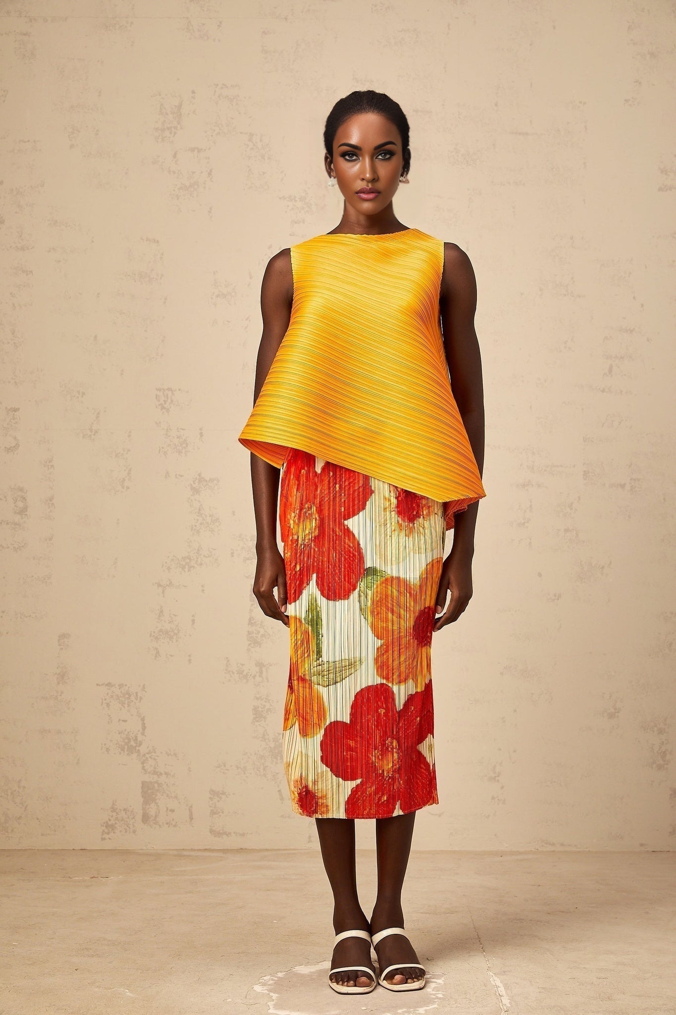 Woman wearing amberorange matching set with crinkled fabric top and skirt Zazie brand outfit against plain background