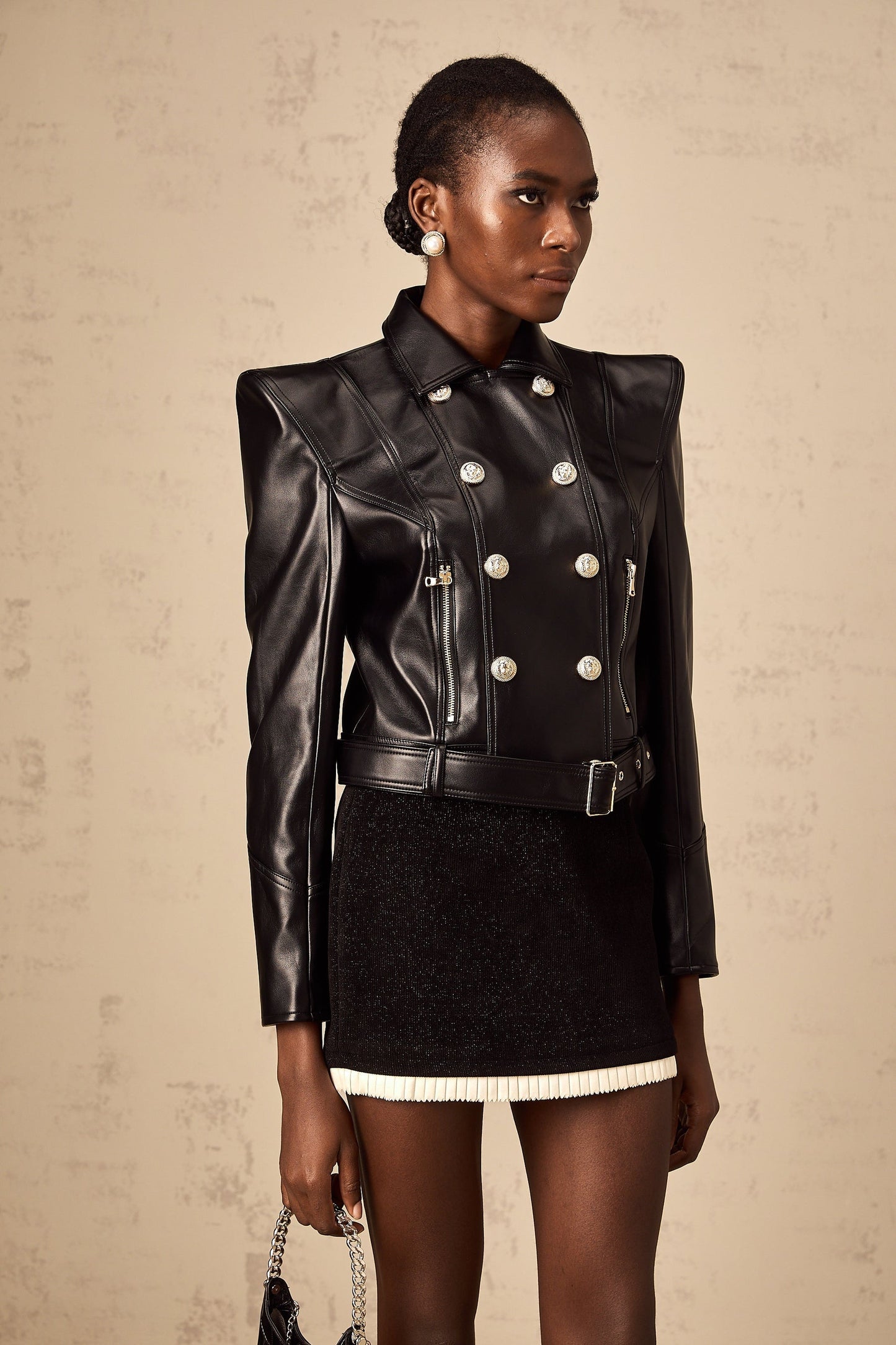 Woman wearing black faux leather double breasted jacket styled by Diane
