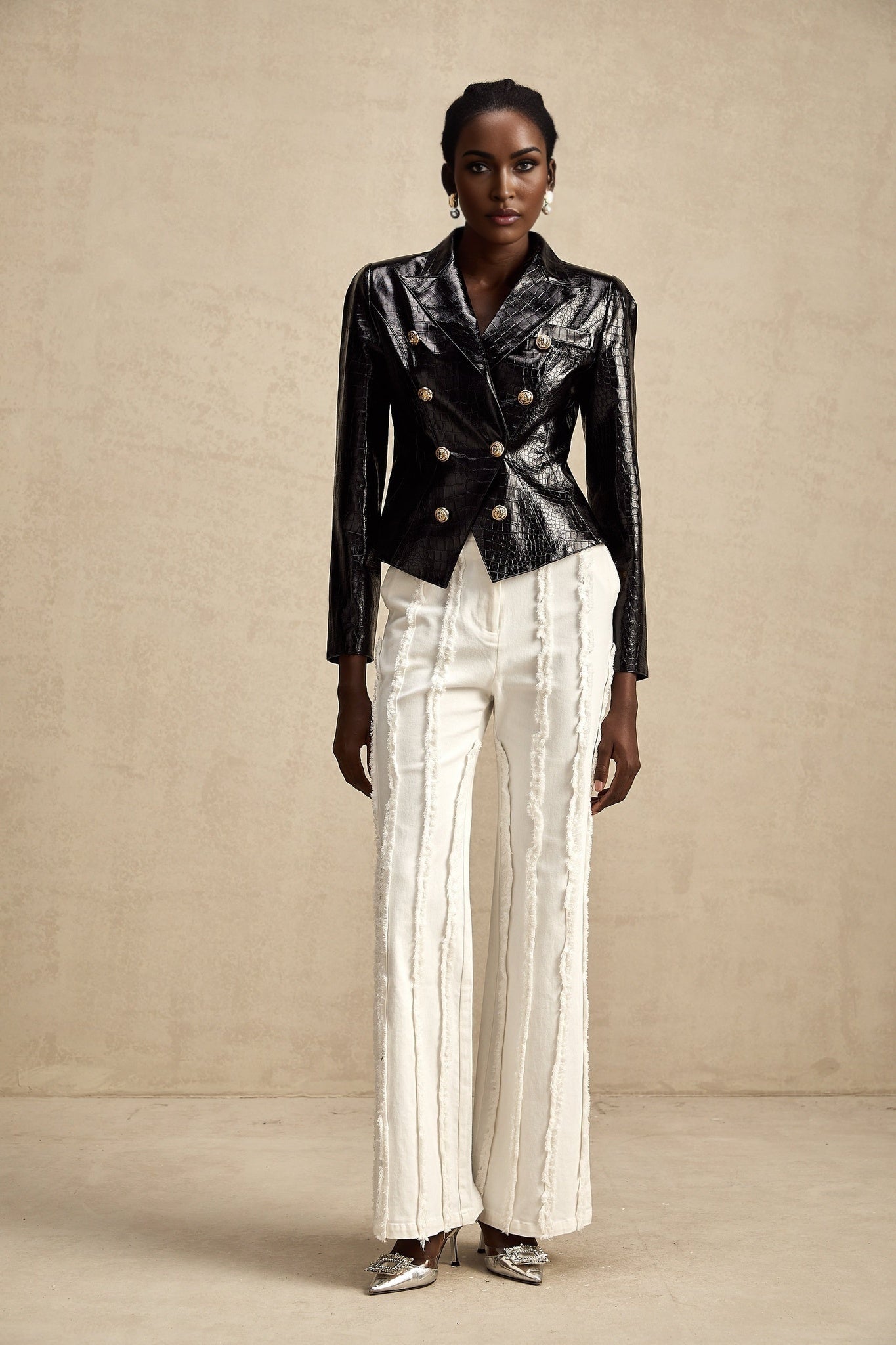 Woman wearing black leather jacket with cinched waist