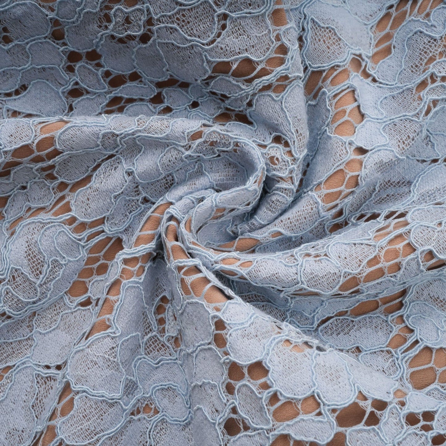 Woman wearing blue floral lace midi dress with boned bodice and fitted silhouette