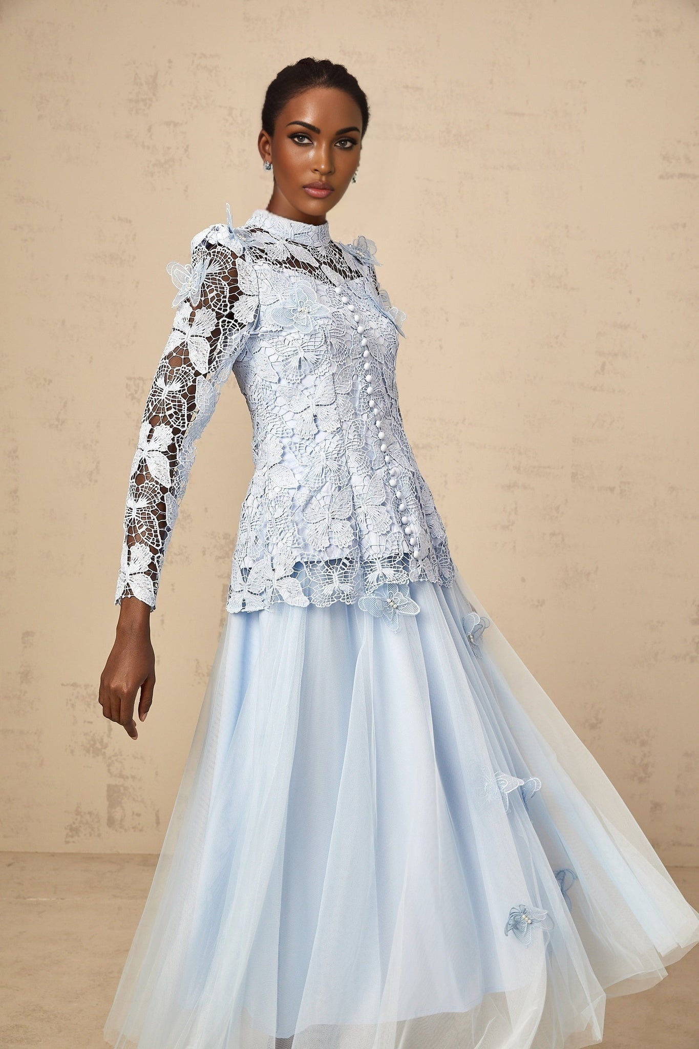 Woman wearing blue sequined lace top and matching skirt set Nicolette outfit shimmering two piece ensemble
