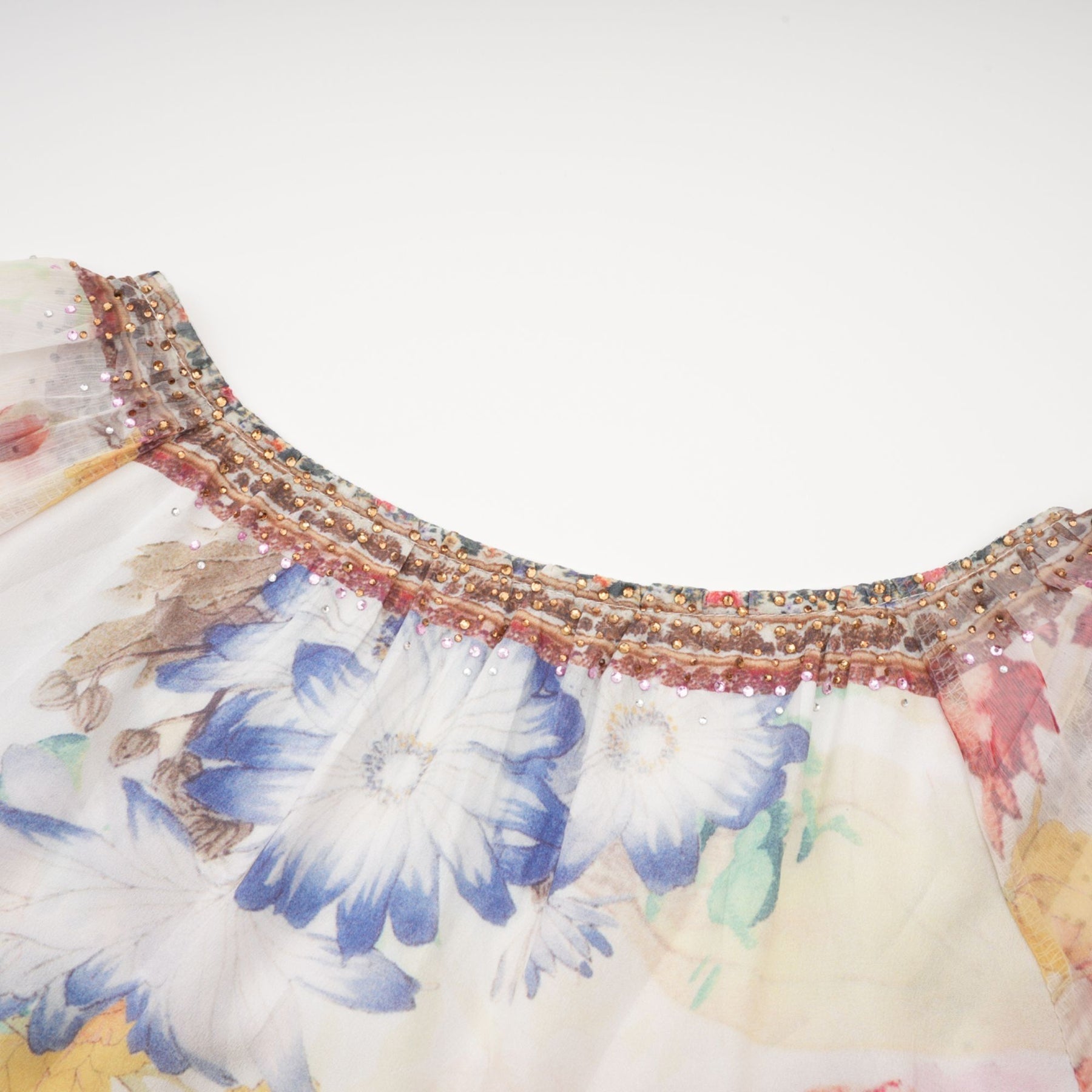 Woman wearing floral printed blouse with v neckline called Yvonne