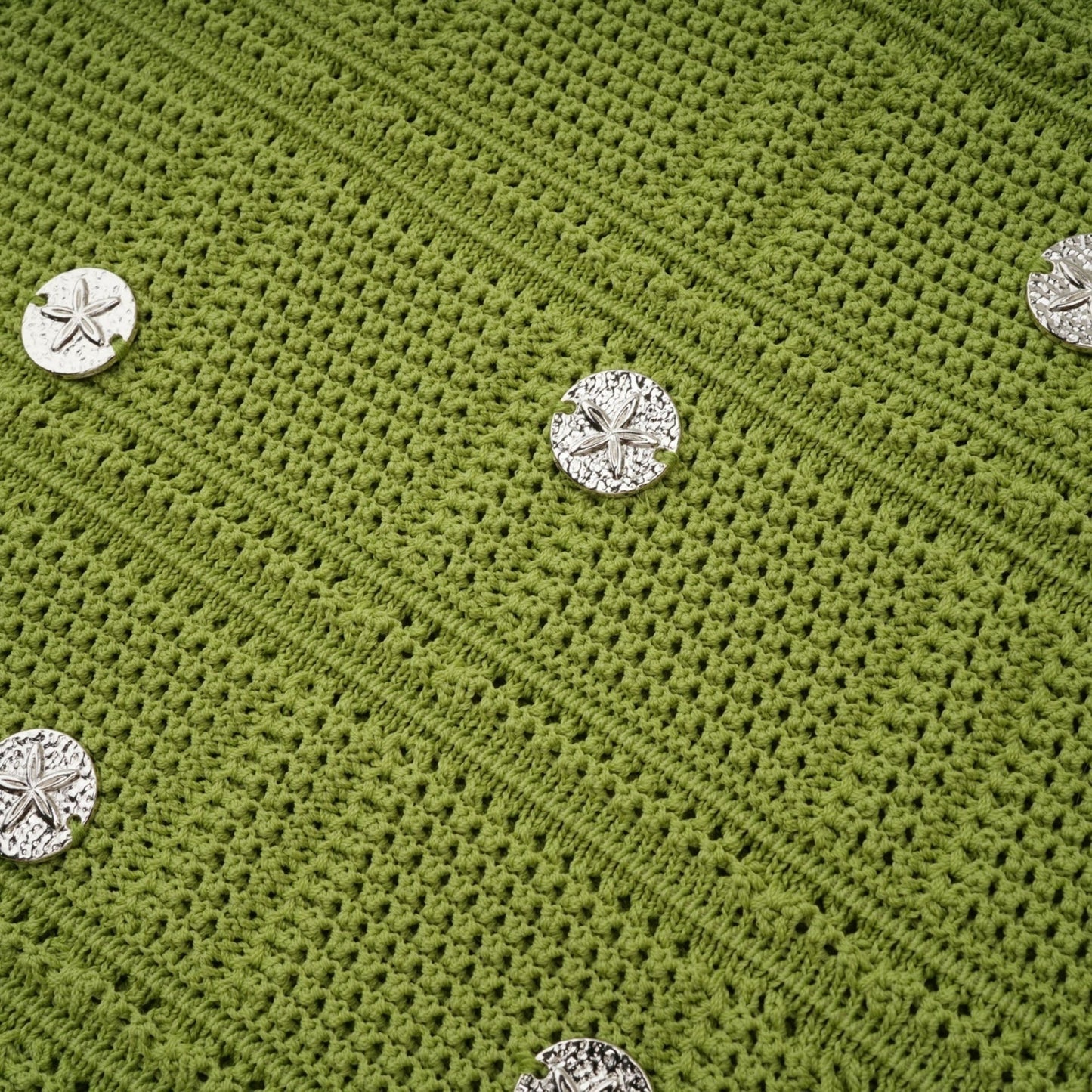 Woman wearing green knit top and matching skirt set with embellishments Annette style