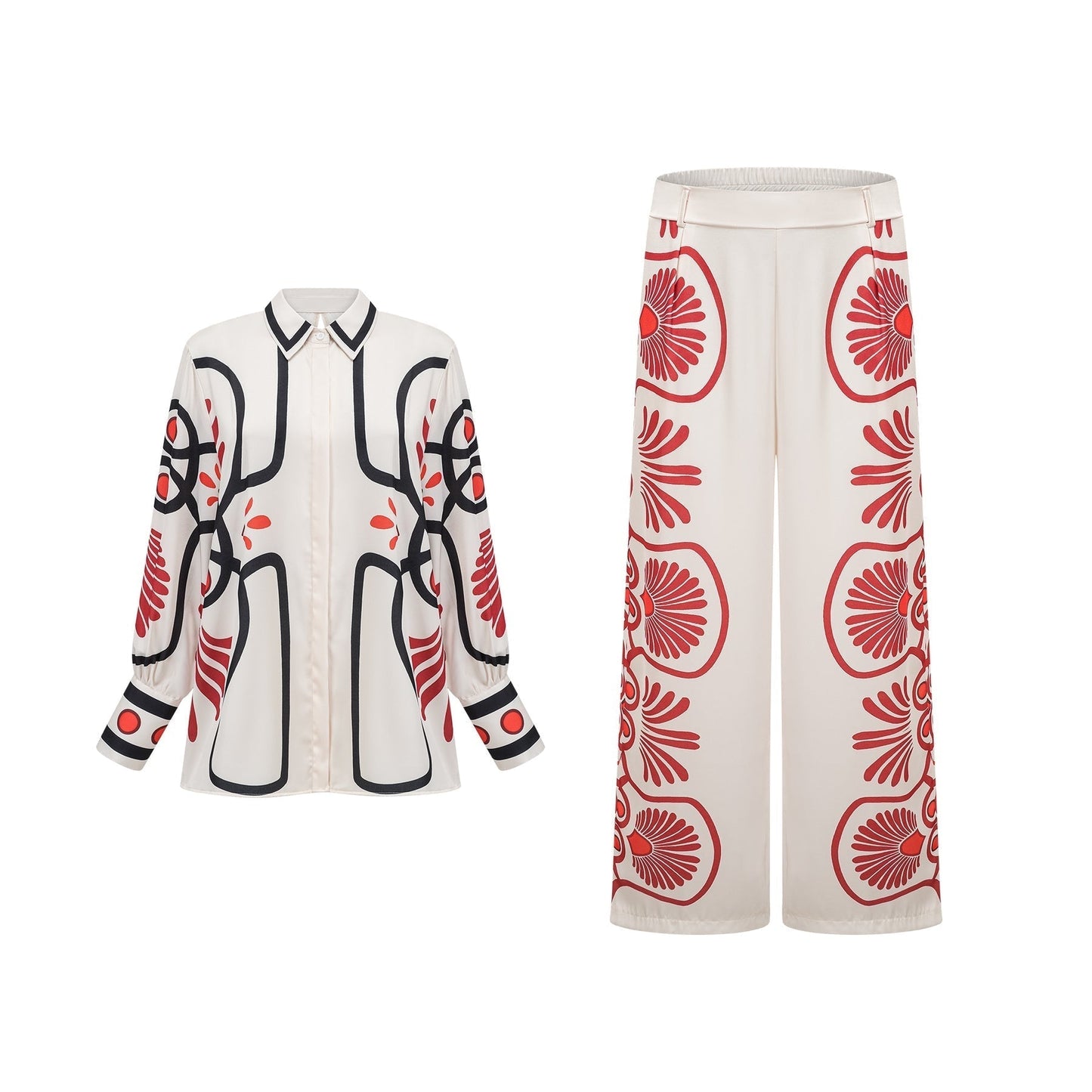 Woman wearing matching floral print shirt and trousers set in vibrant colors with tropical leaf pattern